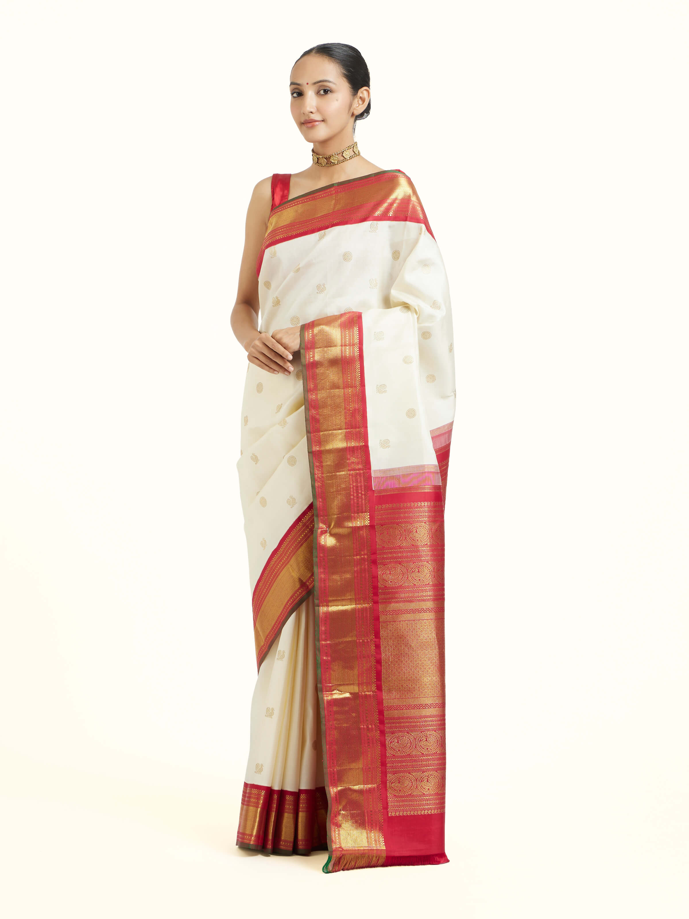 Side view of off-white silk Kancheepuram saree with graceful drape and contrast border