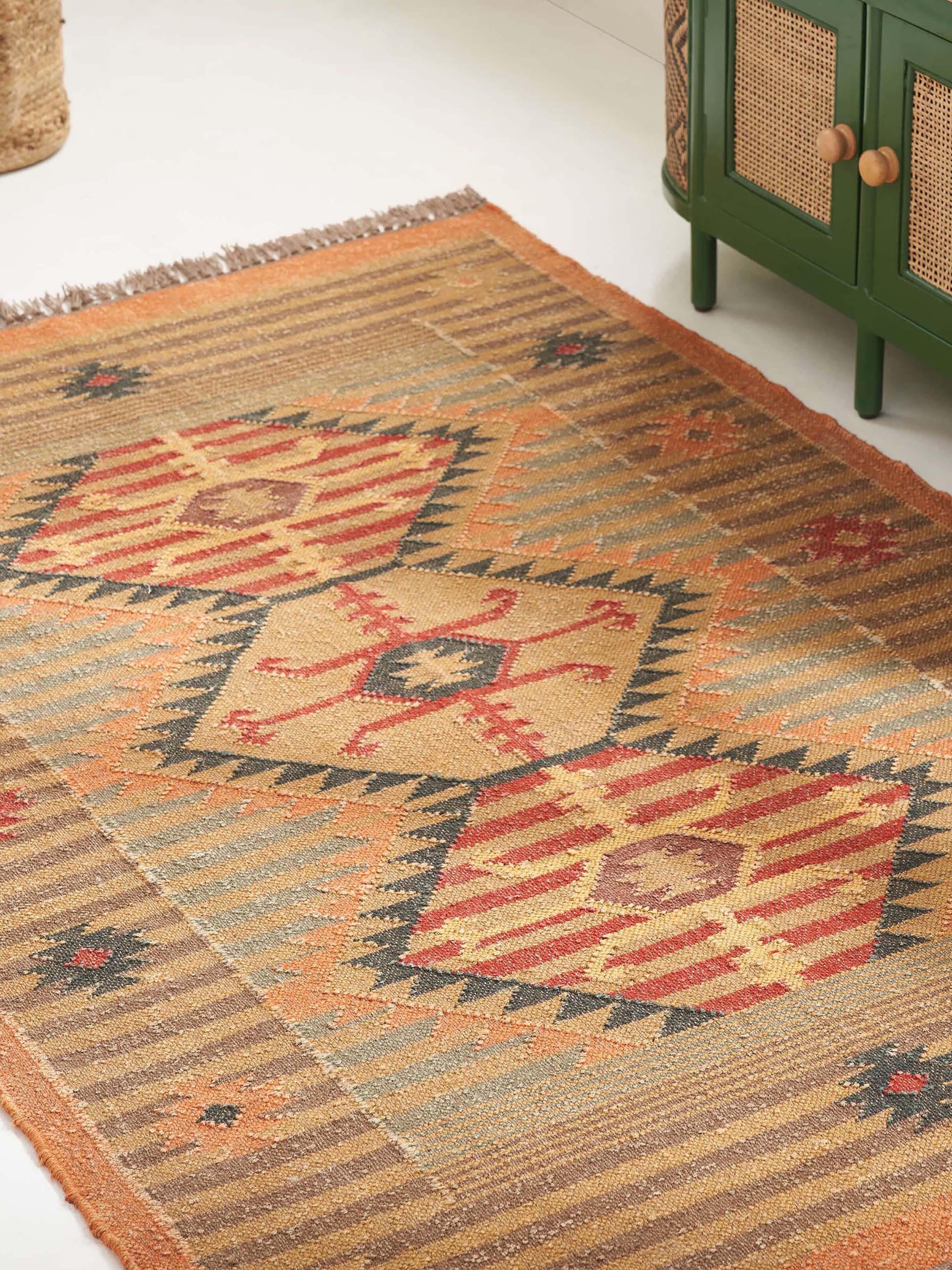 Close-up view of Traditional Kilim rust Lawan jute and wool Panja dhurrie highlighting the texture and detailed weaving