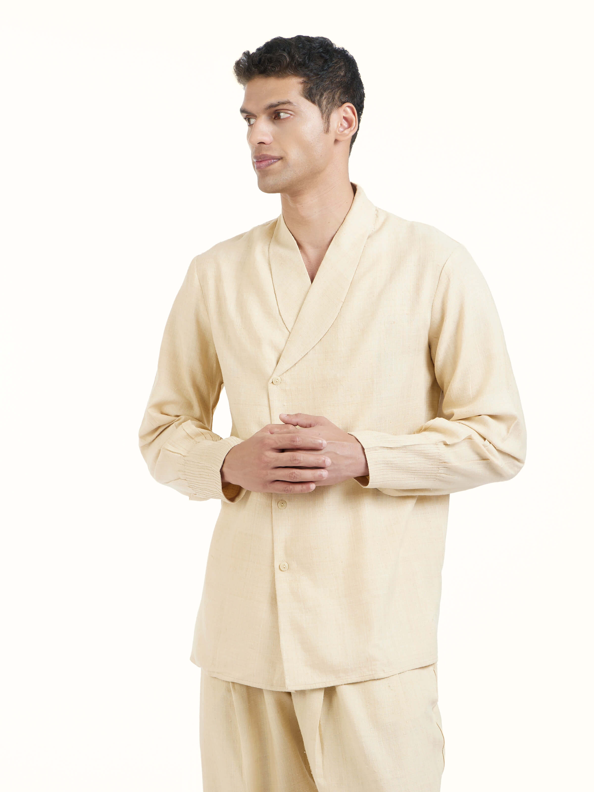 Angled view of beige silk handloom jacket emphasizing handloom weave