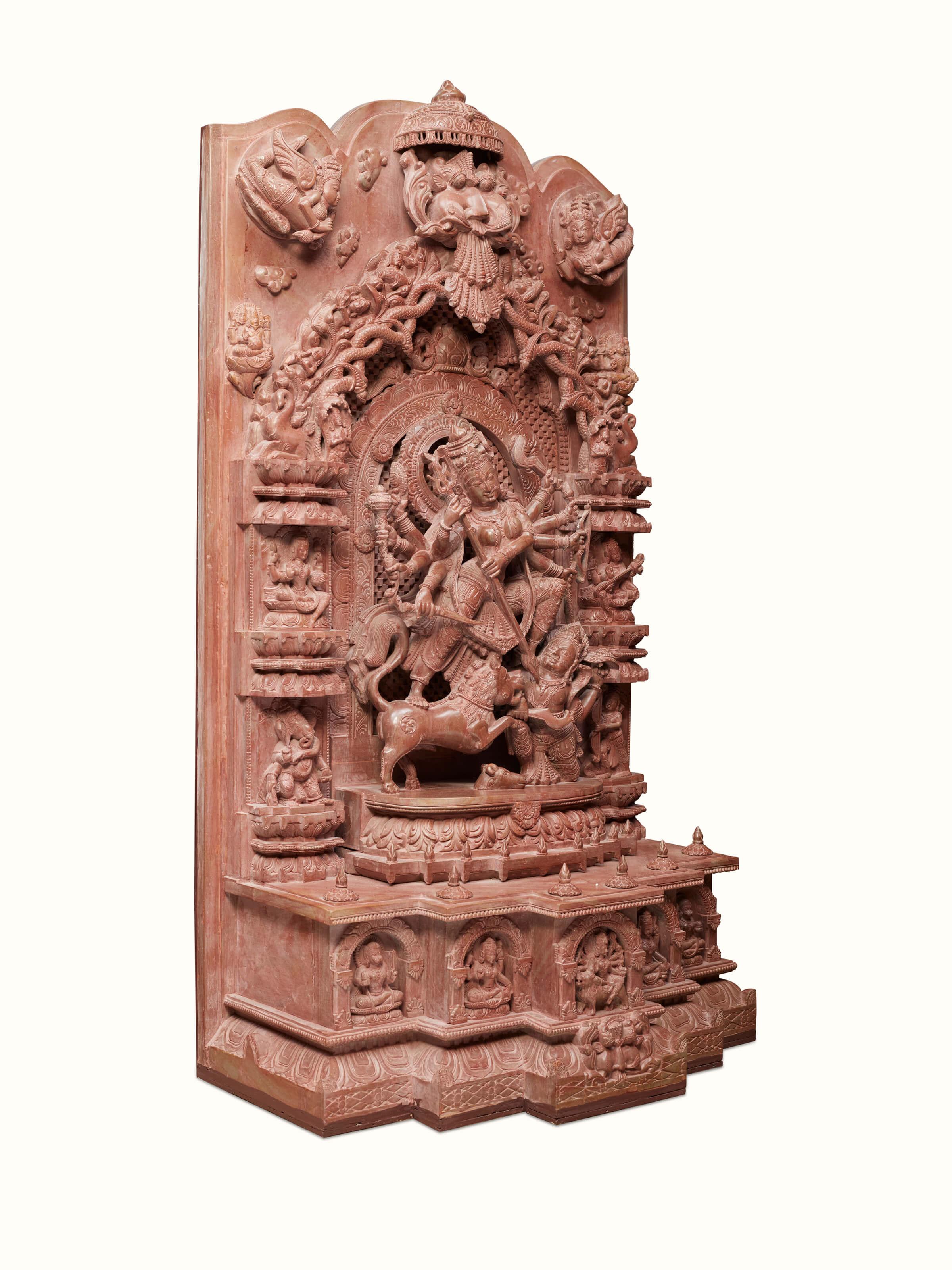 Side view of Stone Devi Idol highlighting its intricate carving and solid stone texture.