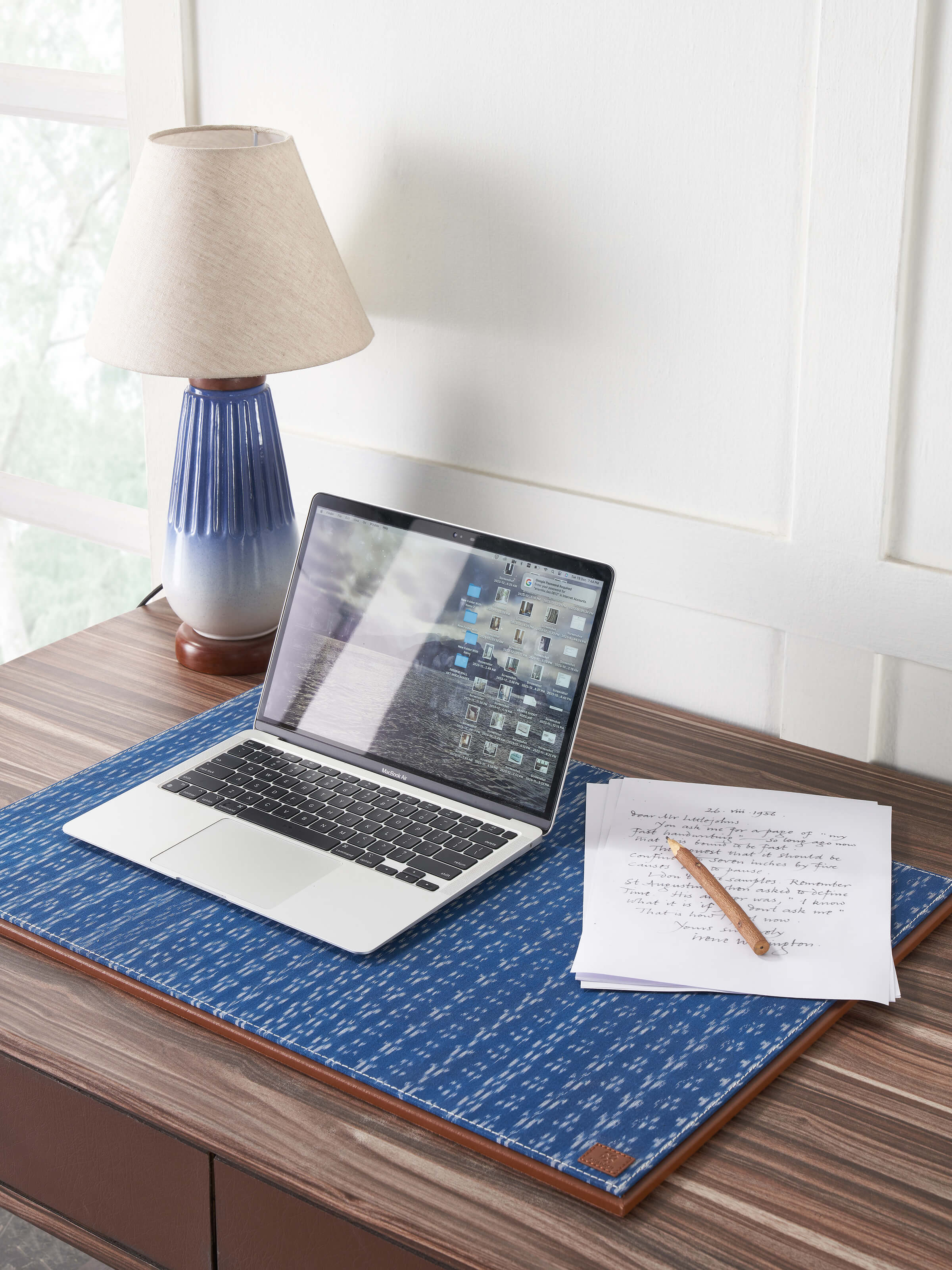 Side view of Swadesh Leather Desk Blotter in blue showing its refined craftsmanship and sleek profile.