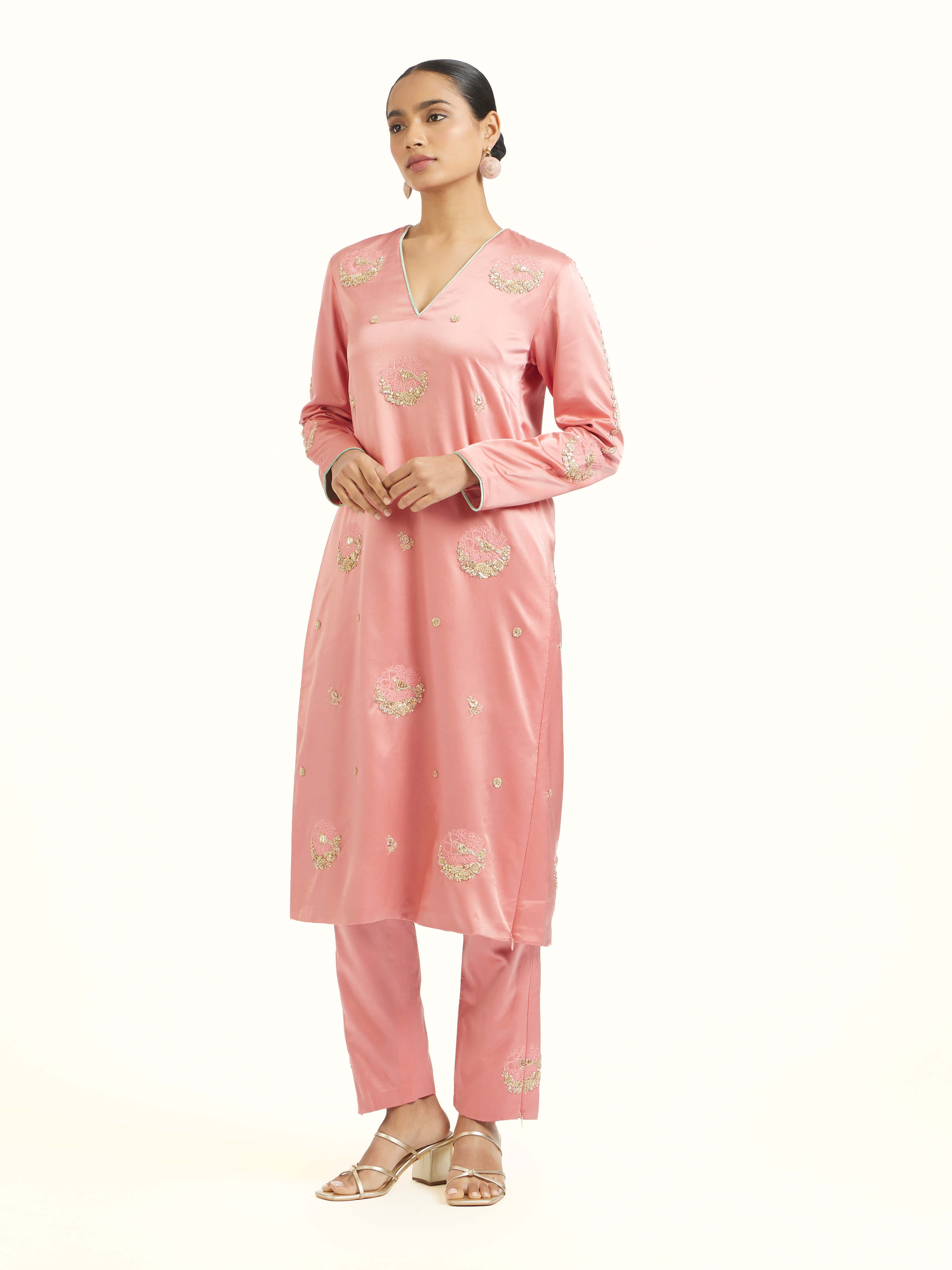 Side view of orchid pink zardozi kurta set highlighting elegant silhouette