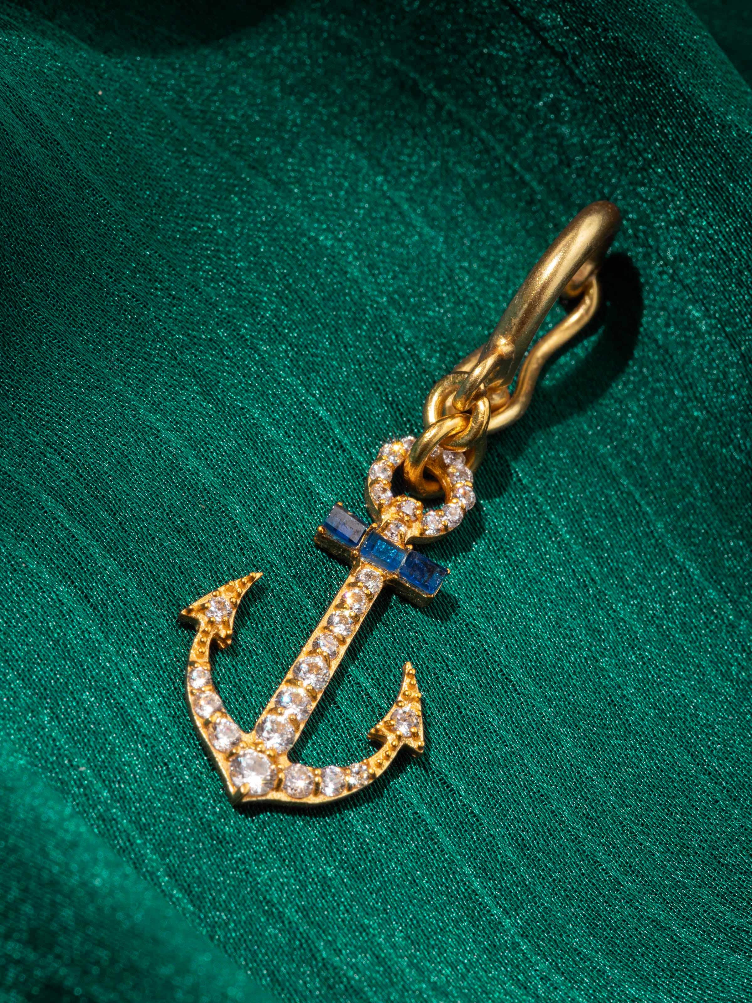 Detail shot of silver pendant capturing hand-carved floral design in oxidized silver.