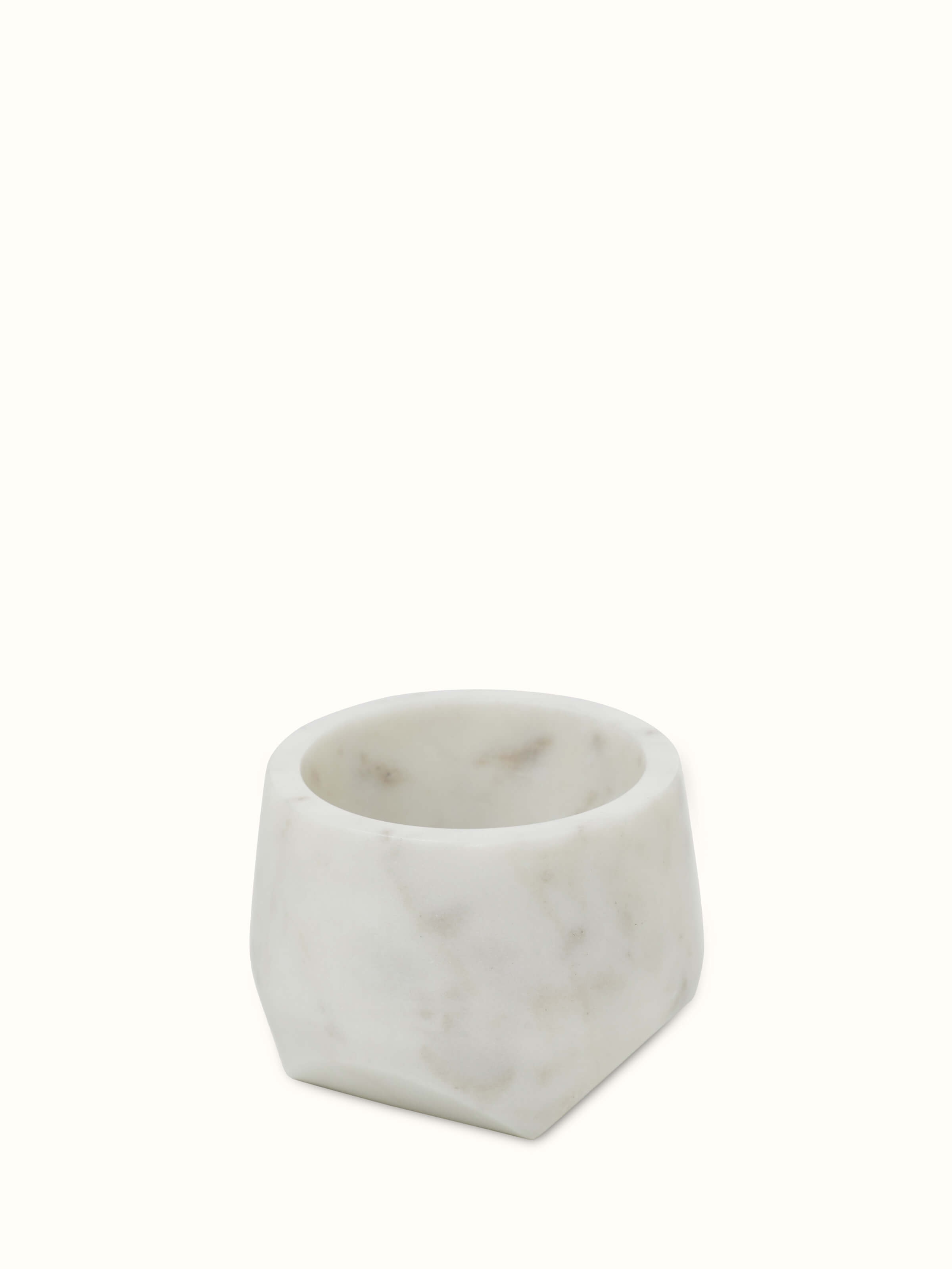 Close-up of Carved marble mortar & pestle showcasing detailed carving