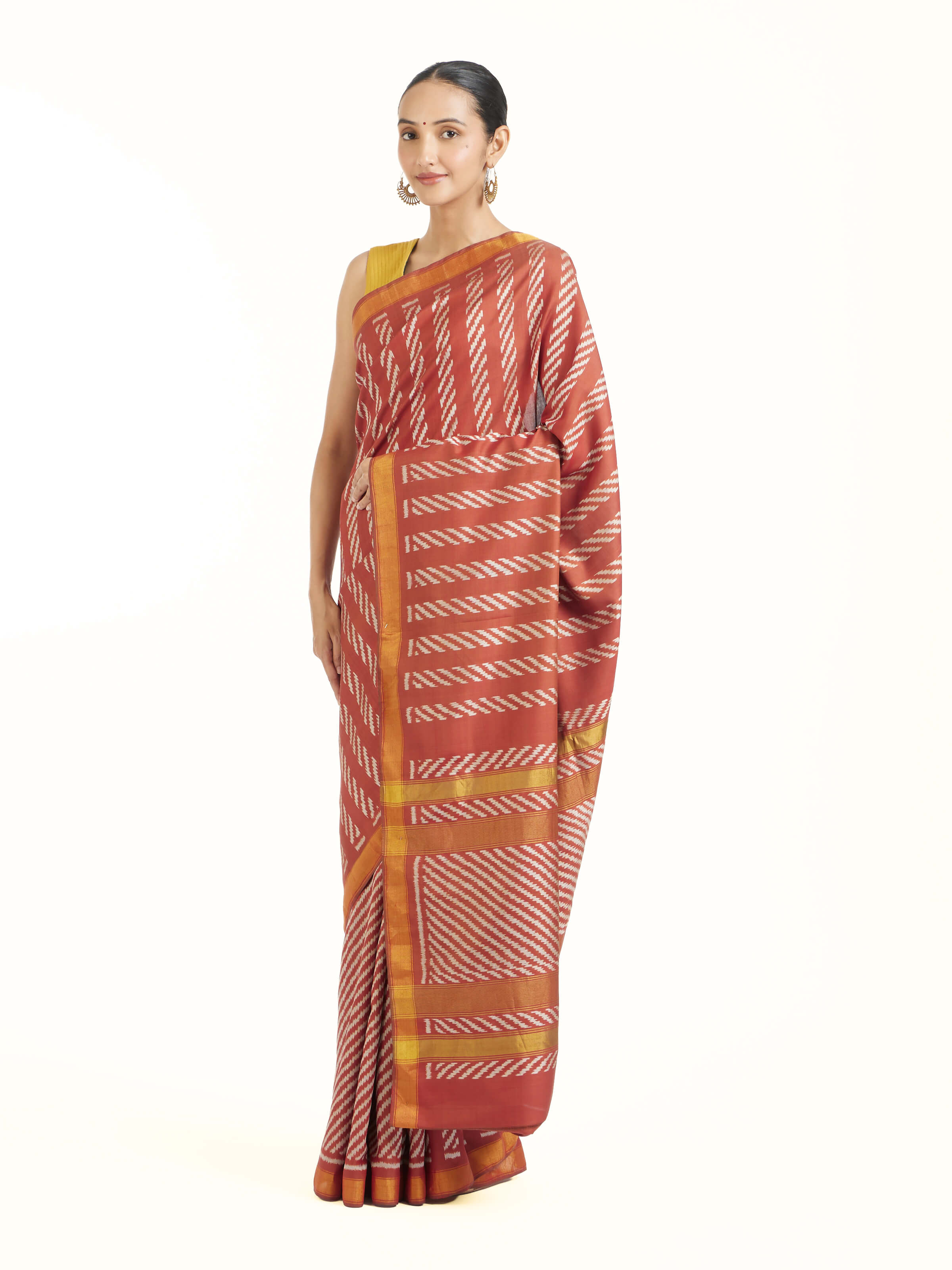 Side view of pink mulberry silk Patola saree showcasing structured drape
