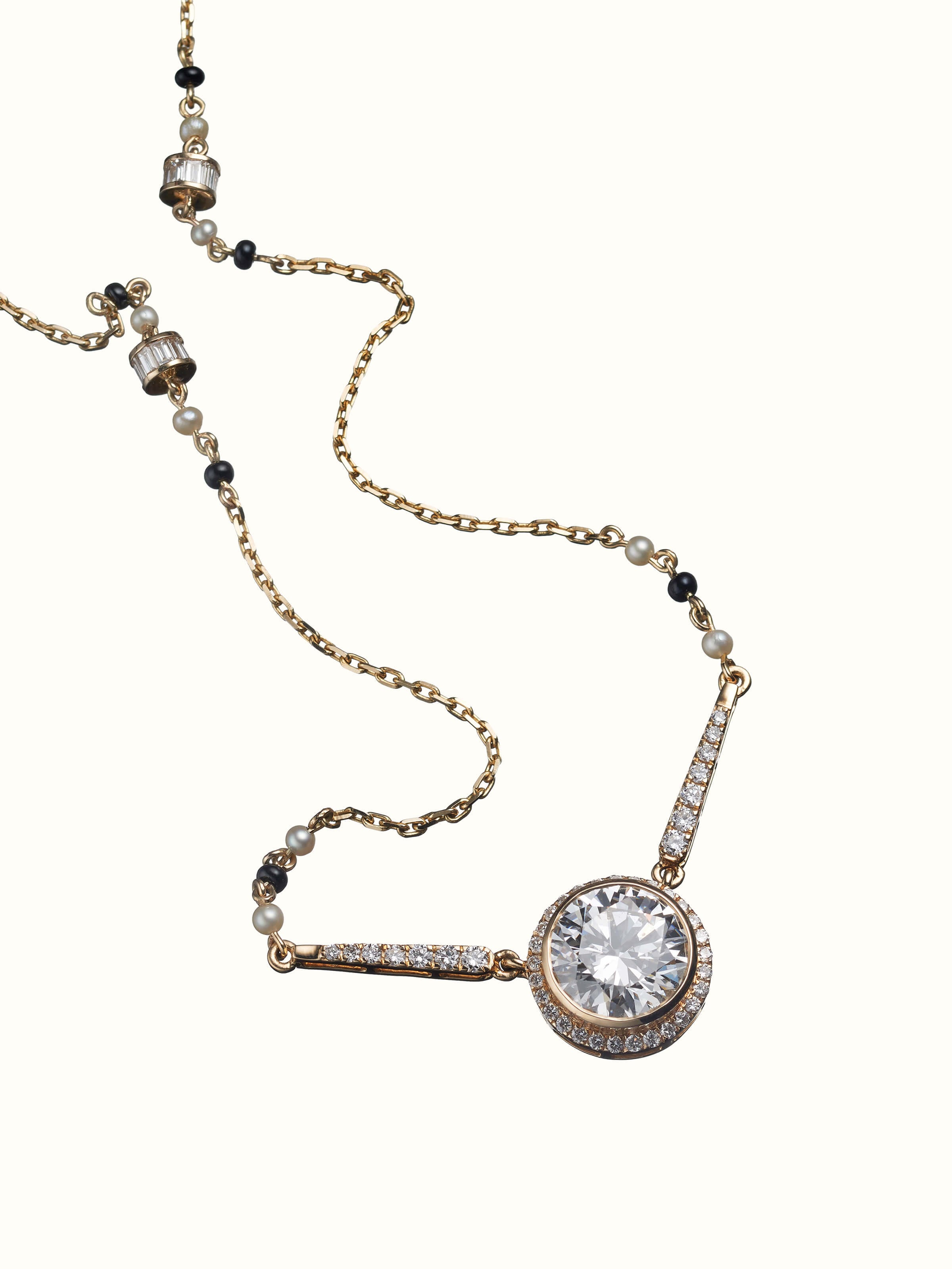 angled view of open setting 14 karat gold mangalsutra