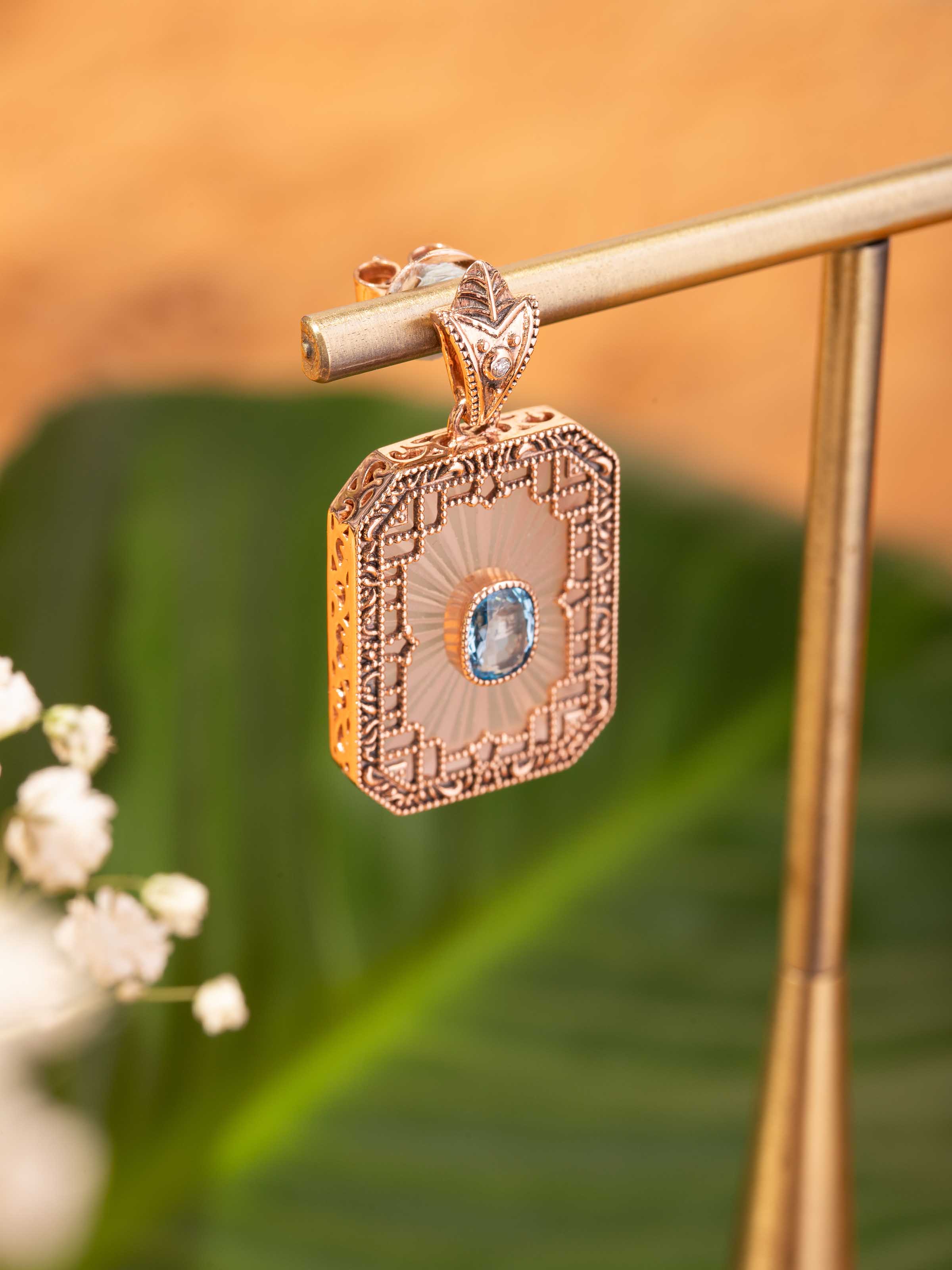 Lifestyle view of lapidary 14 karat gold drop earrings