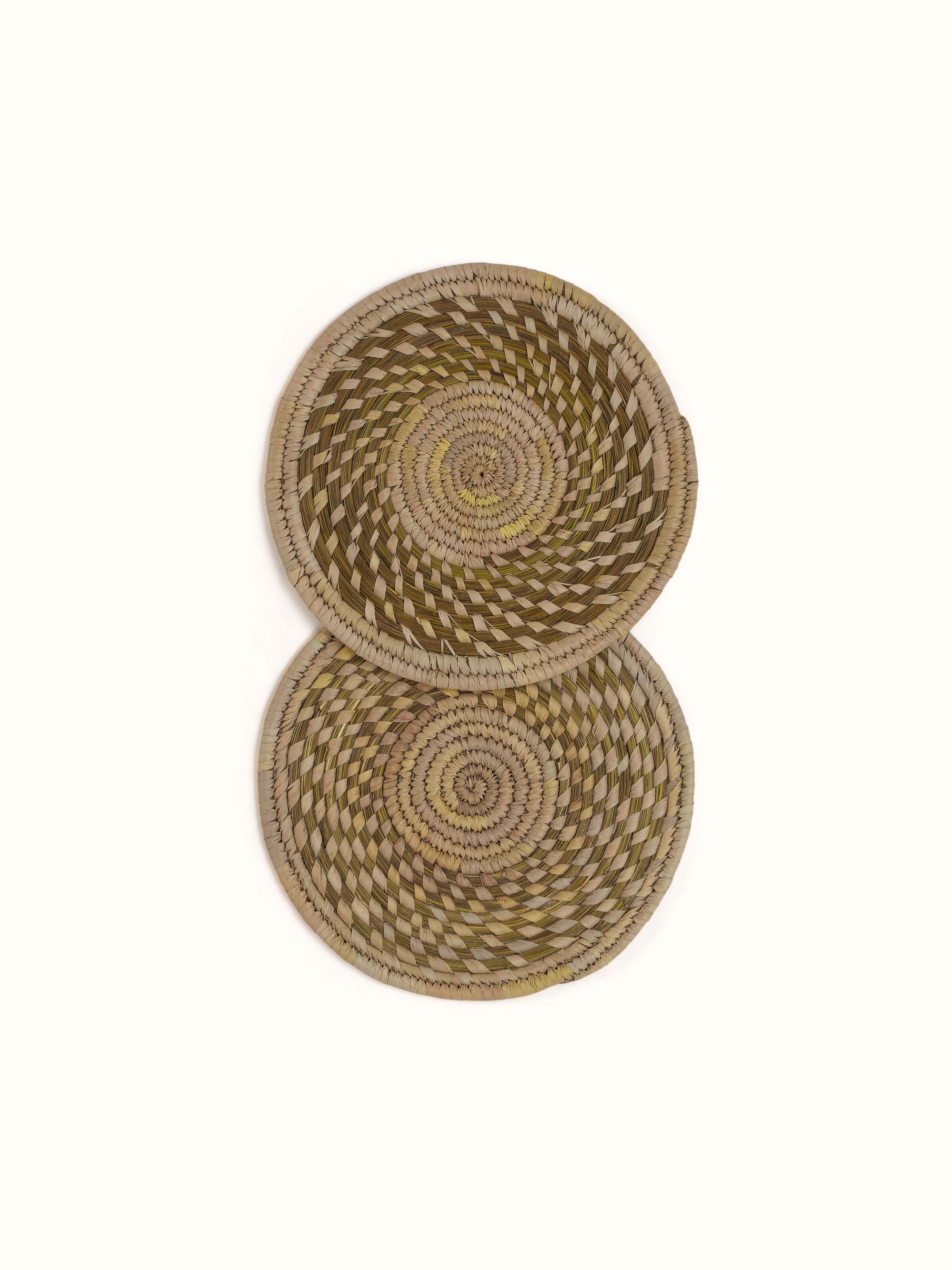 Front view showing the full round shape of the light green Sabai grass trivets