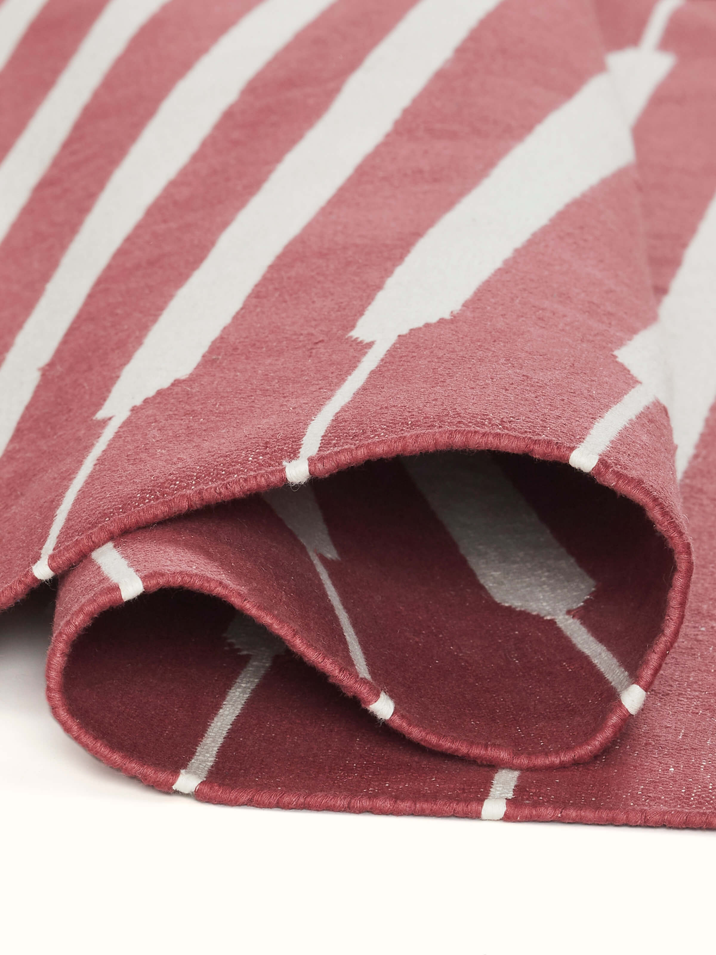 Close-up focusing on the fine weave and craftsmanship of the Panja dhurrie