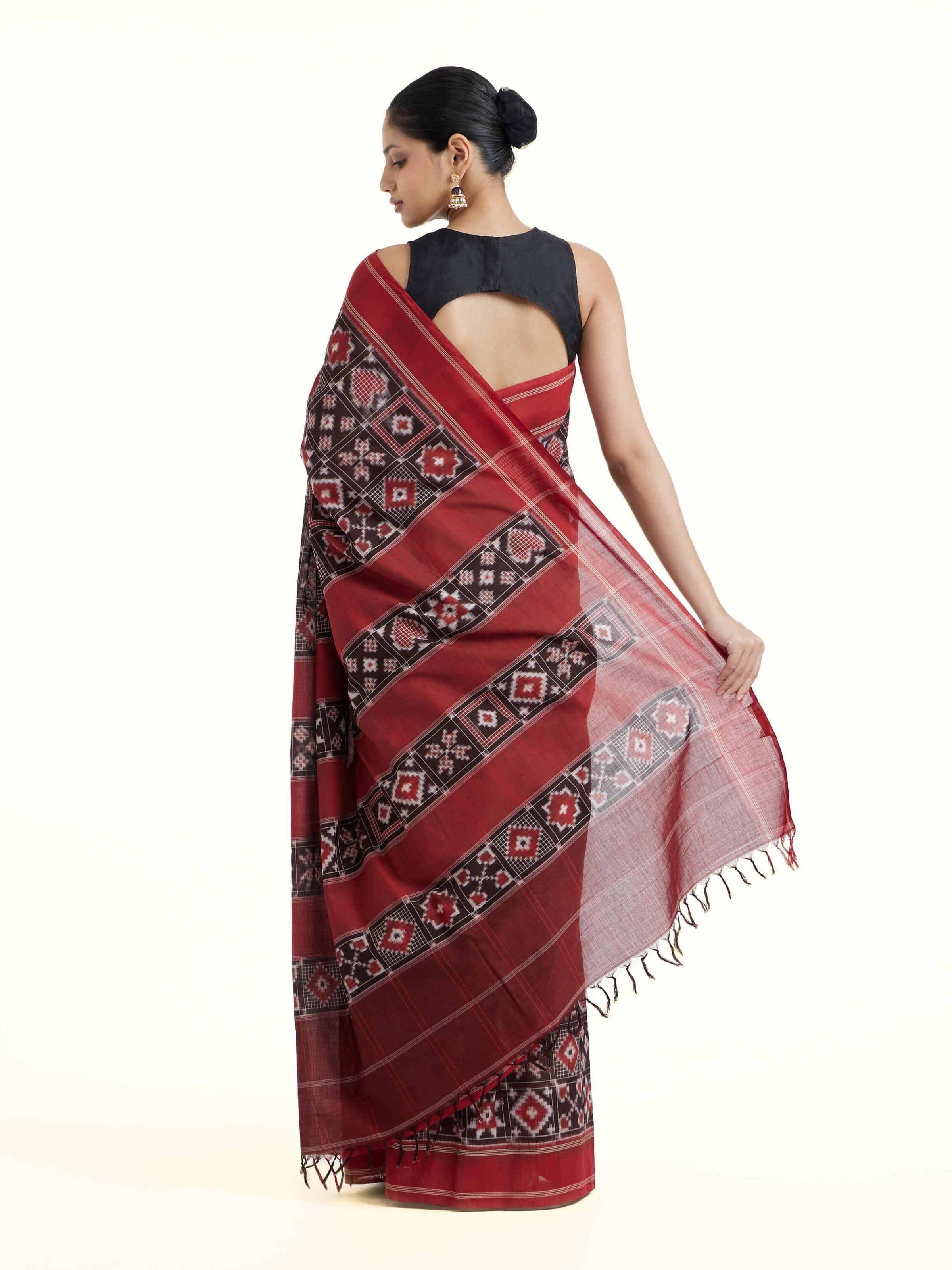 Back view of madder red cotton double ikat saree displaying overall design