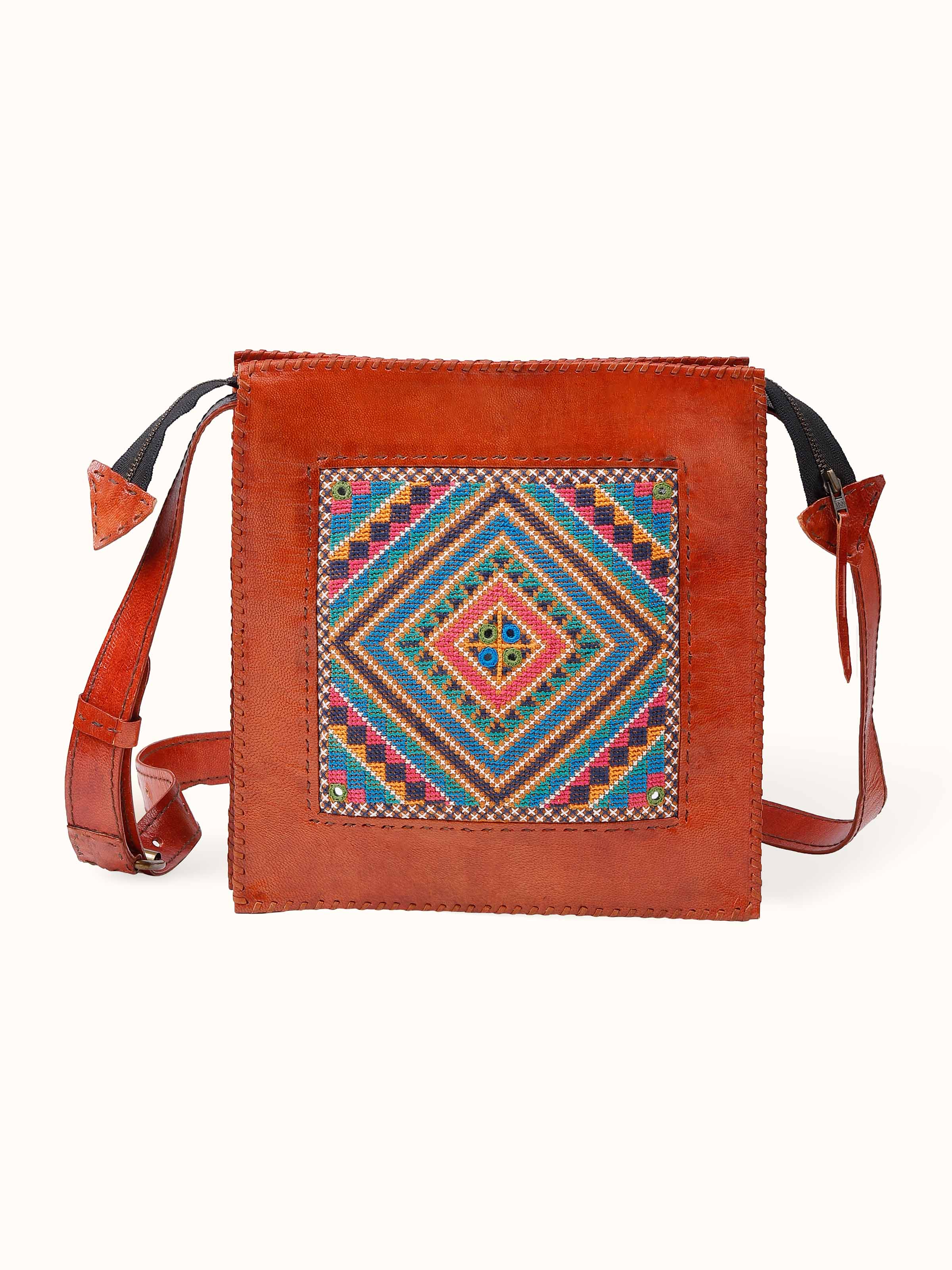 Front view of the richly embroidered Kutchi leather panel sling bag, blending heritage artistry with modern style.
