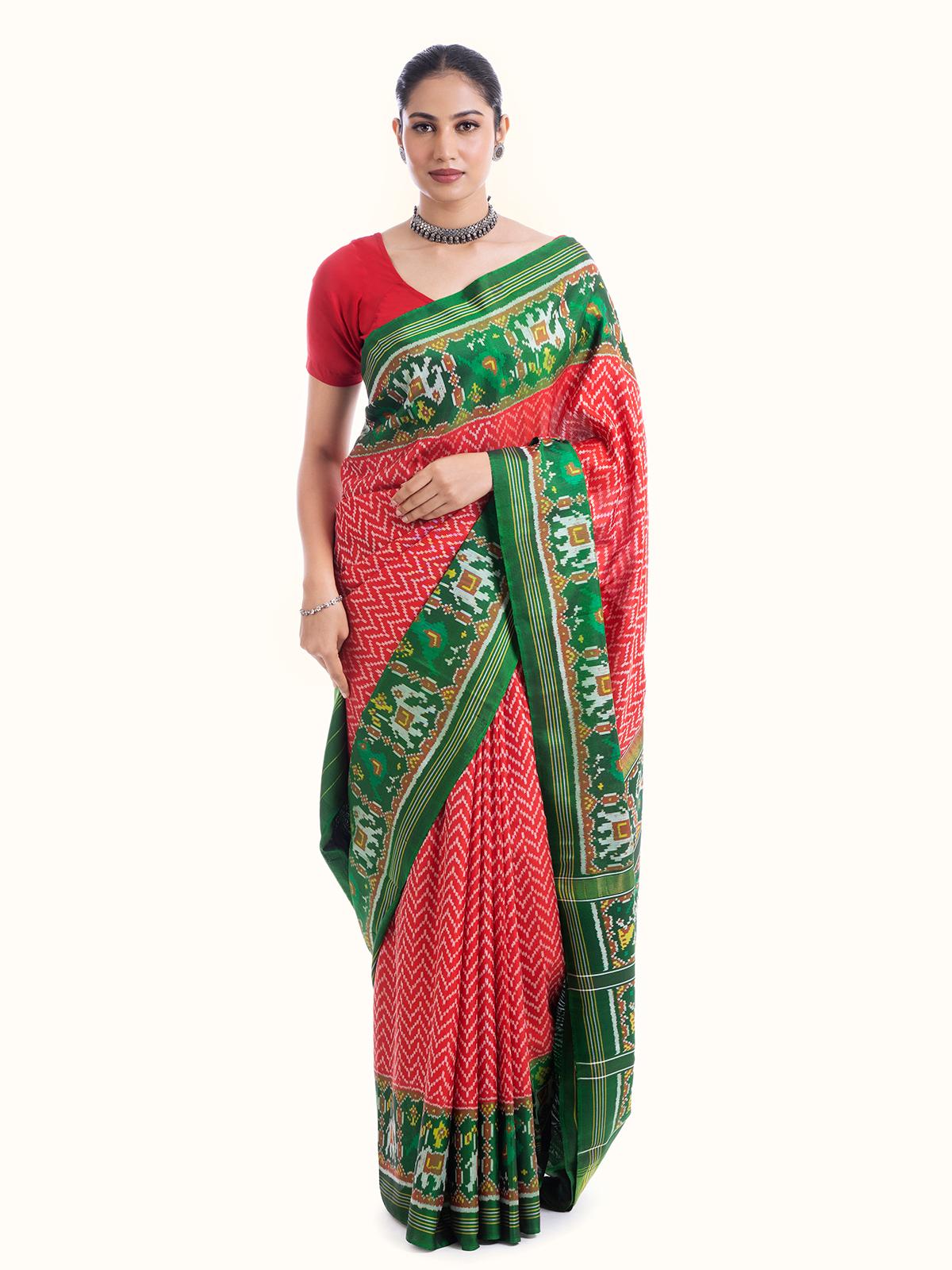 Front view of red silk patola saree featuring detailed traditional patola weave and vibrant hue