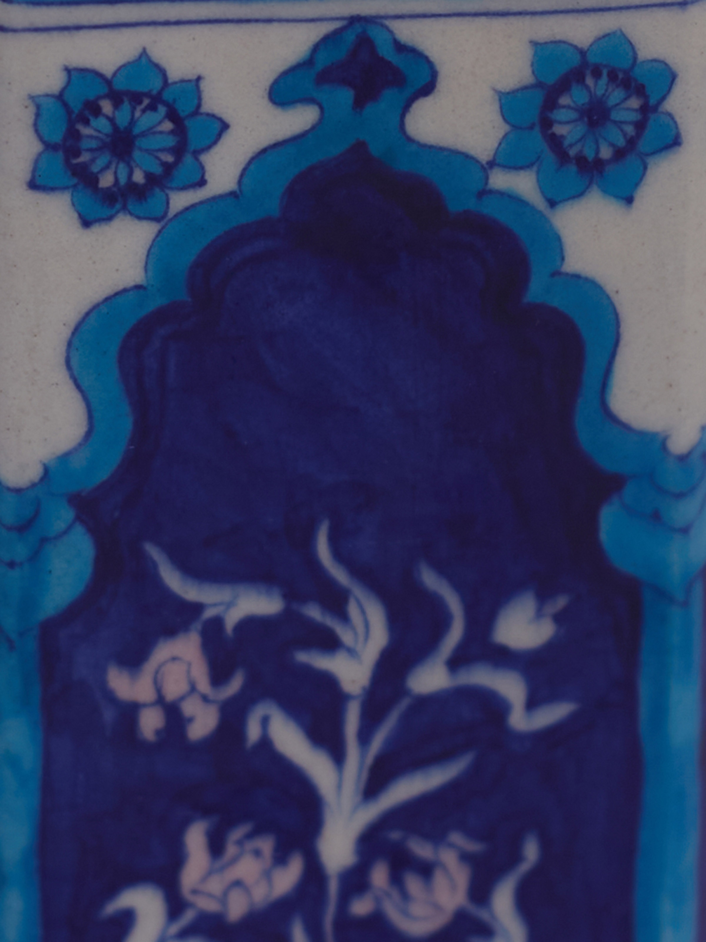 Detail shot of blue pottery baari ceramic planter showing hand painted details