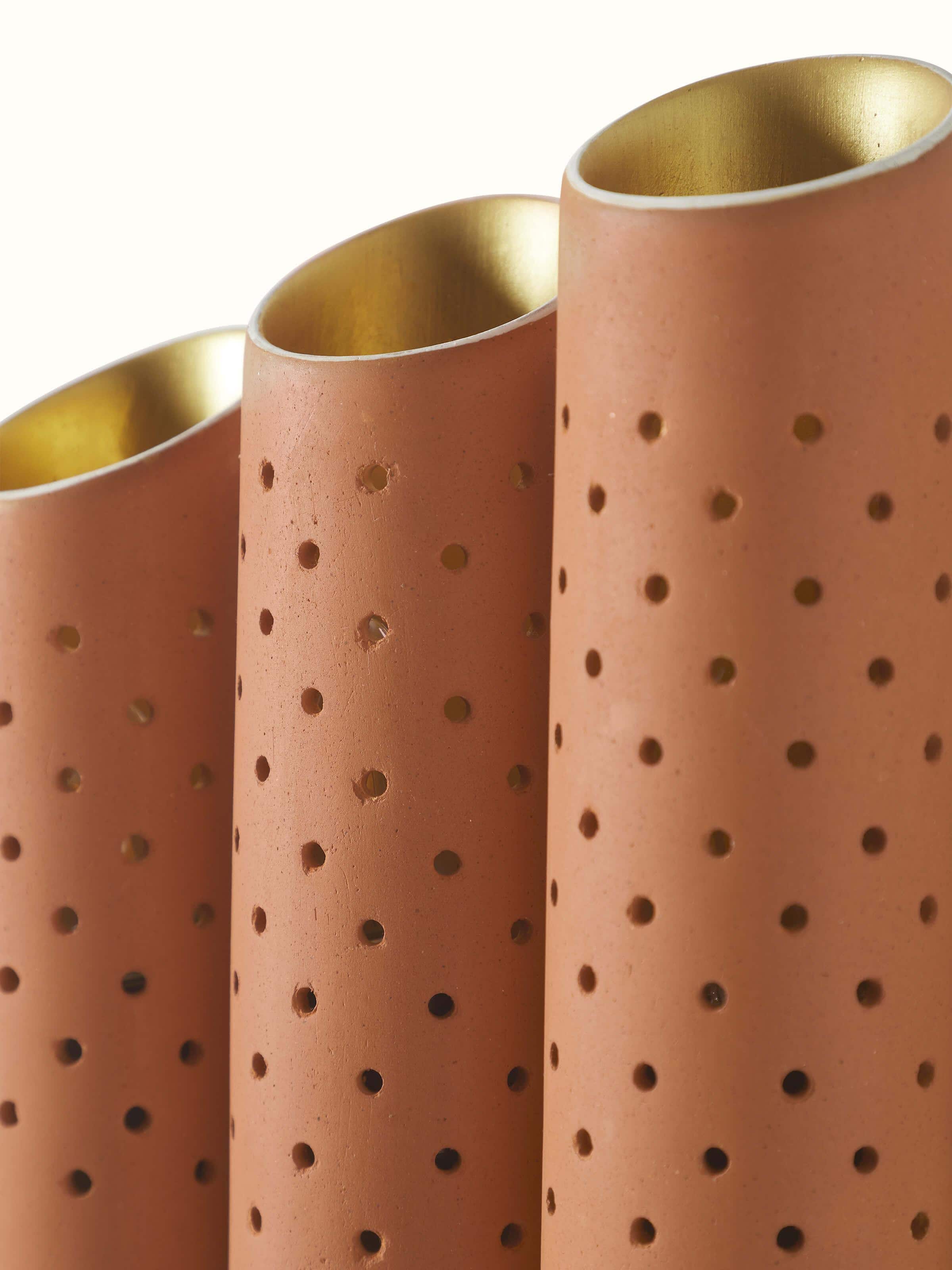 Detailed view of natural terracotta wall light, showcasing the intricate patterns and texture.