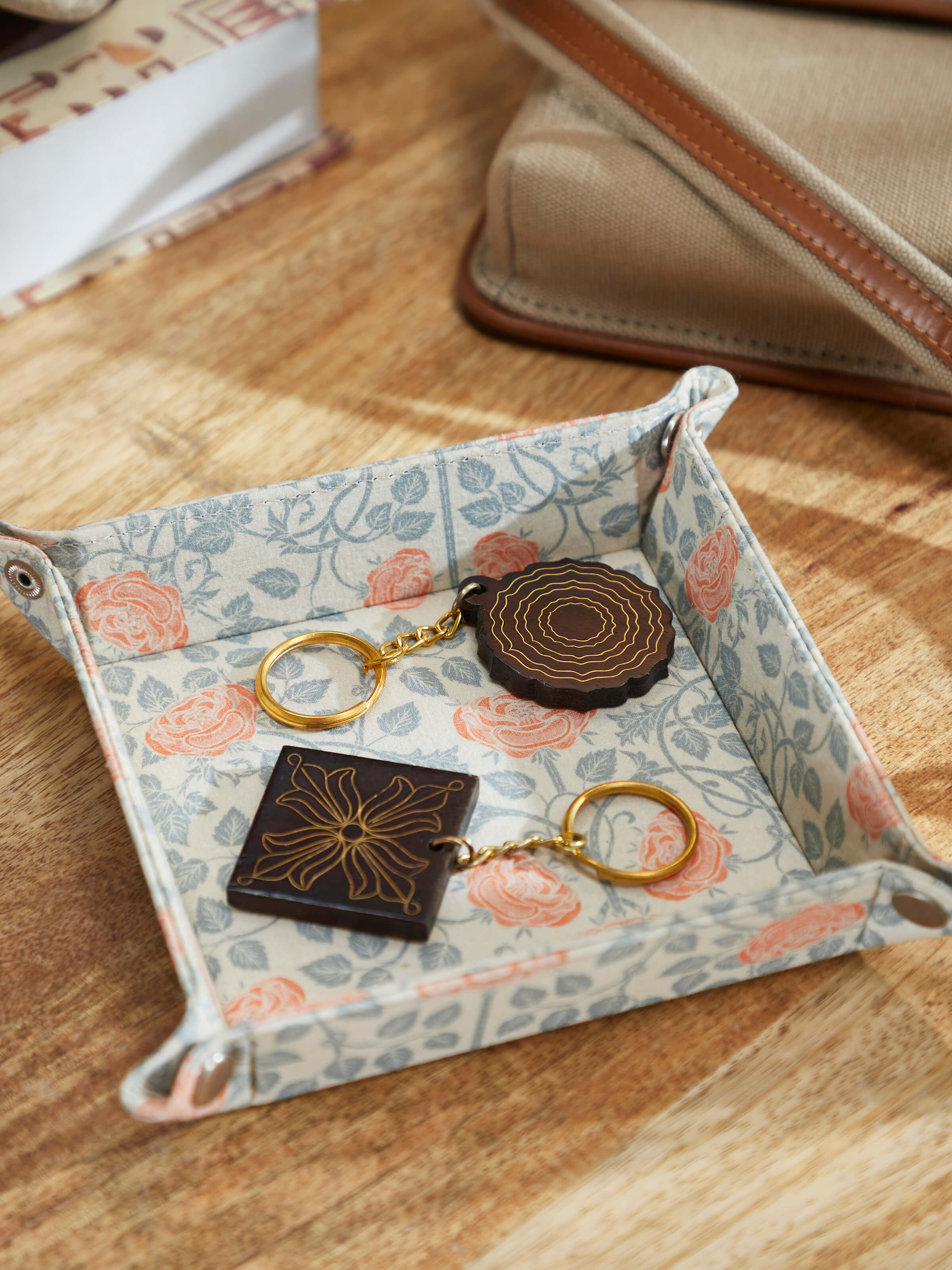 Side view of Tarkashi Sheesham wood & brass keychains highlighting their natural wood finish and brass inlays