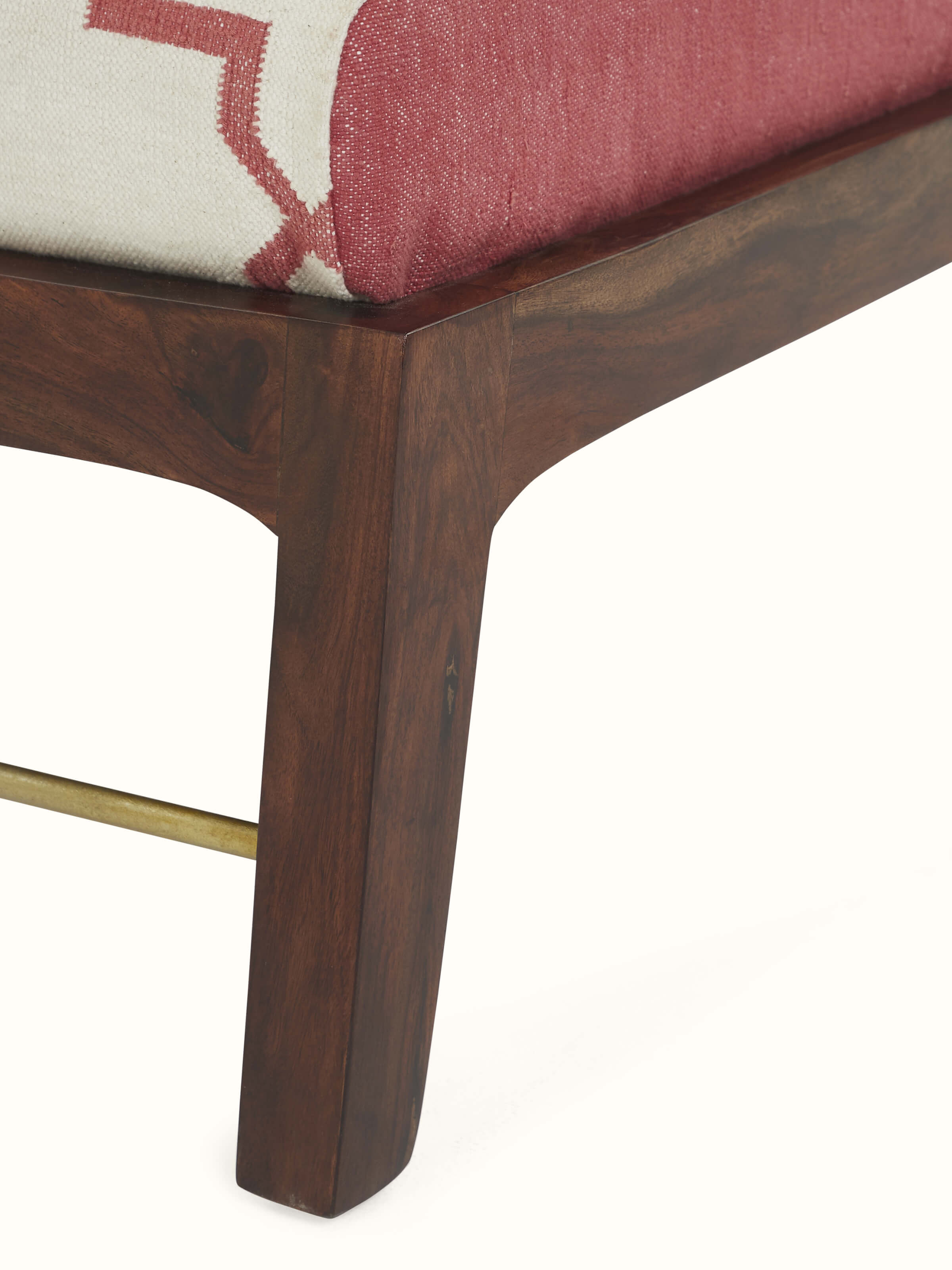 Close-up of handcrafted upholstery on Sheesham wood armchair – sustainable Indian furniture by Swadesh