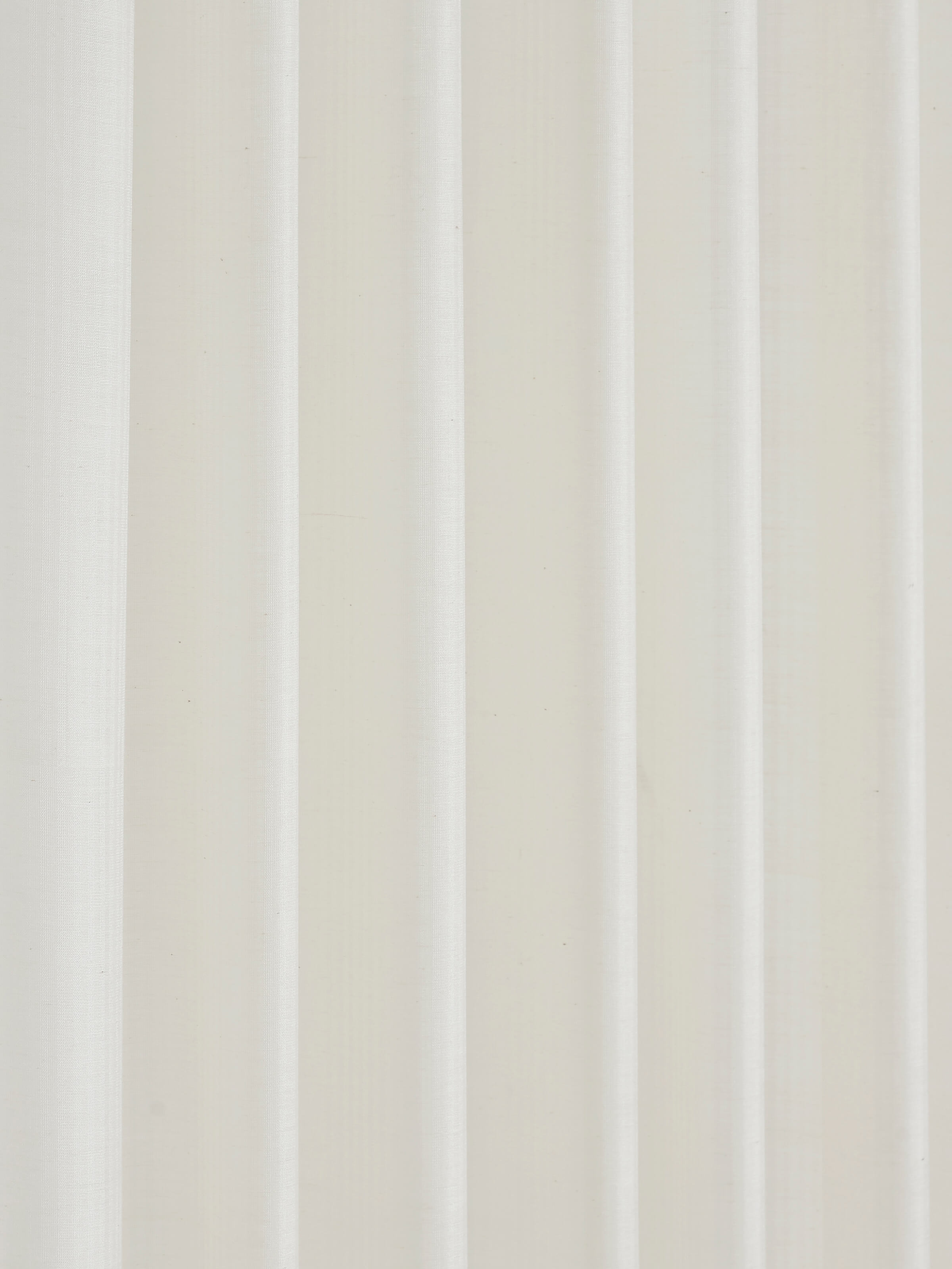 Draped ivory Maheshwari curtain in daylight – 9 ft handloom textile.