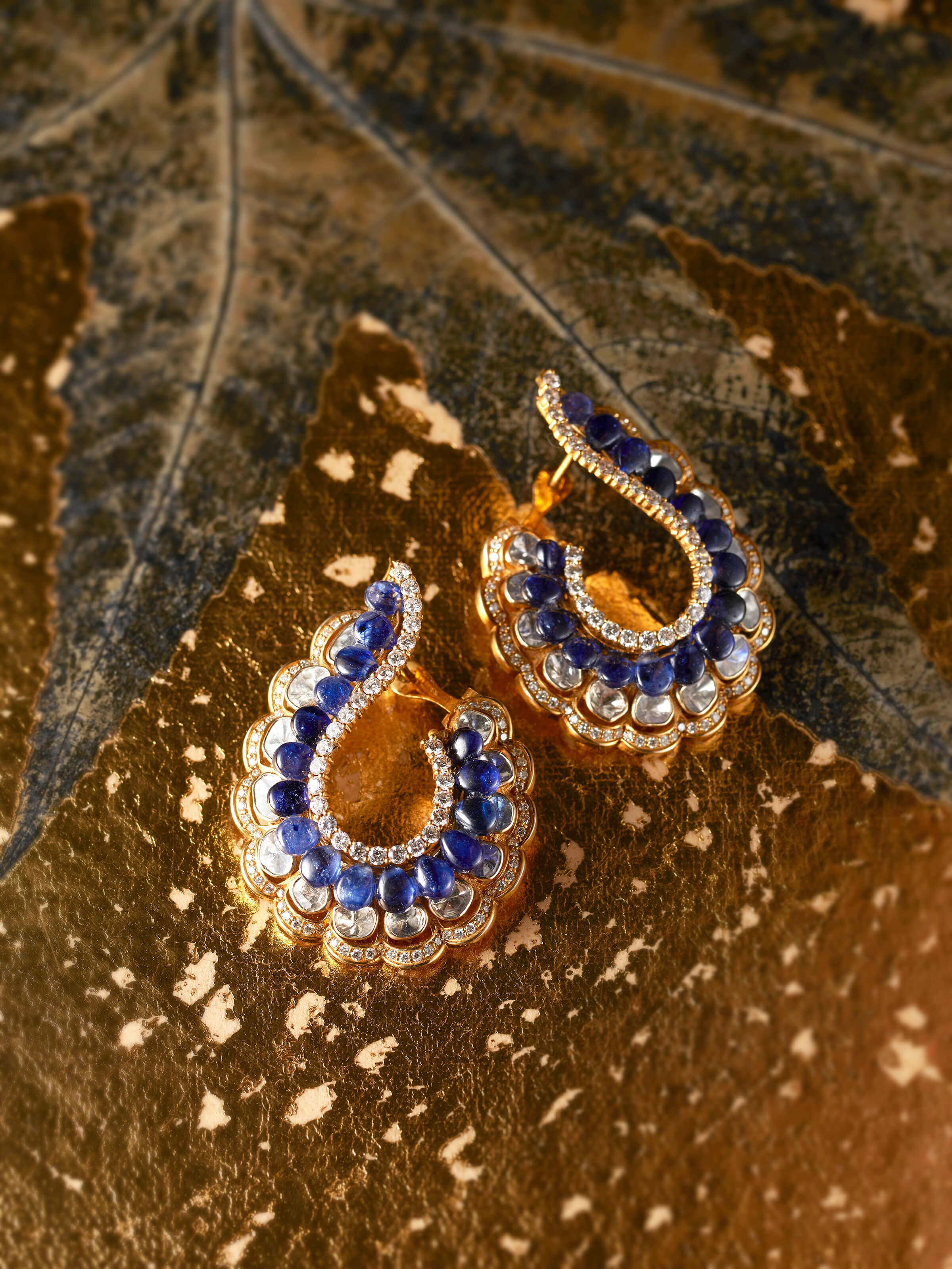 lifestyle view of dank polki 14 karat gold hoop earrings