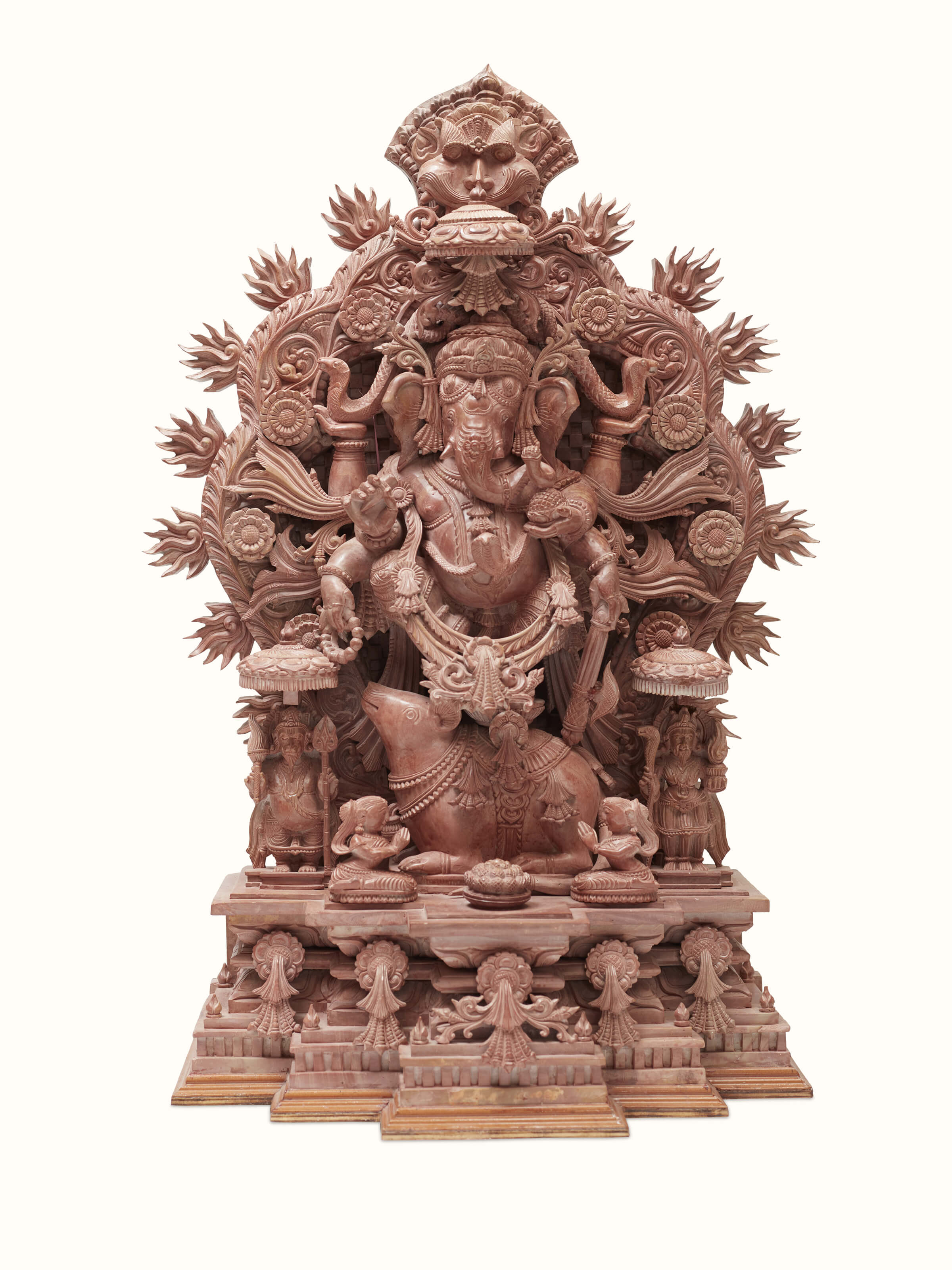 Front view of carved stone Vinayaka idol, highlighting the detailed carving.