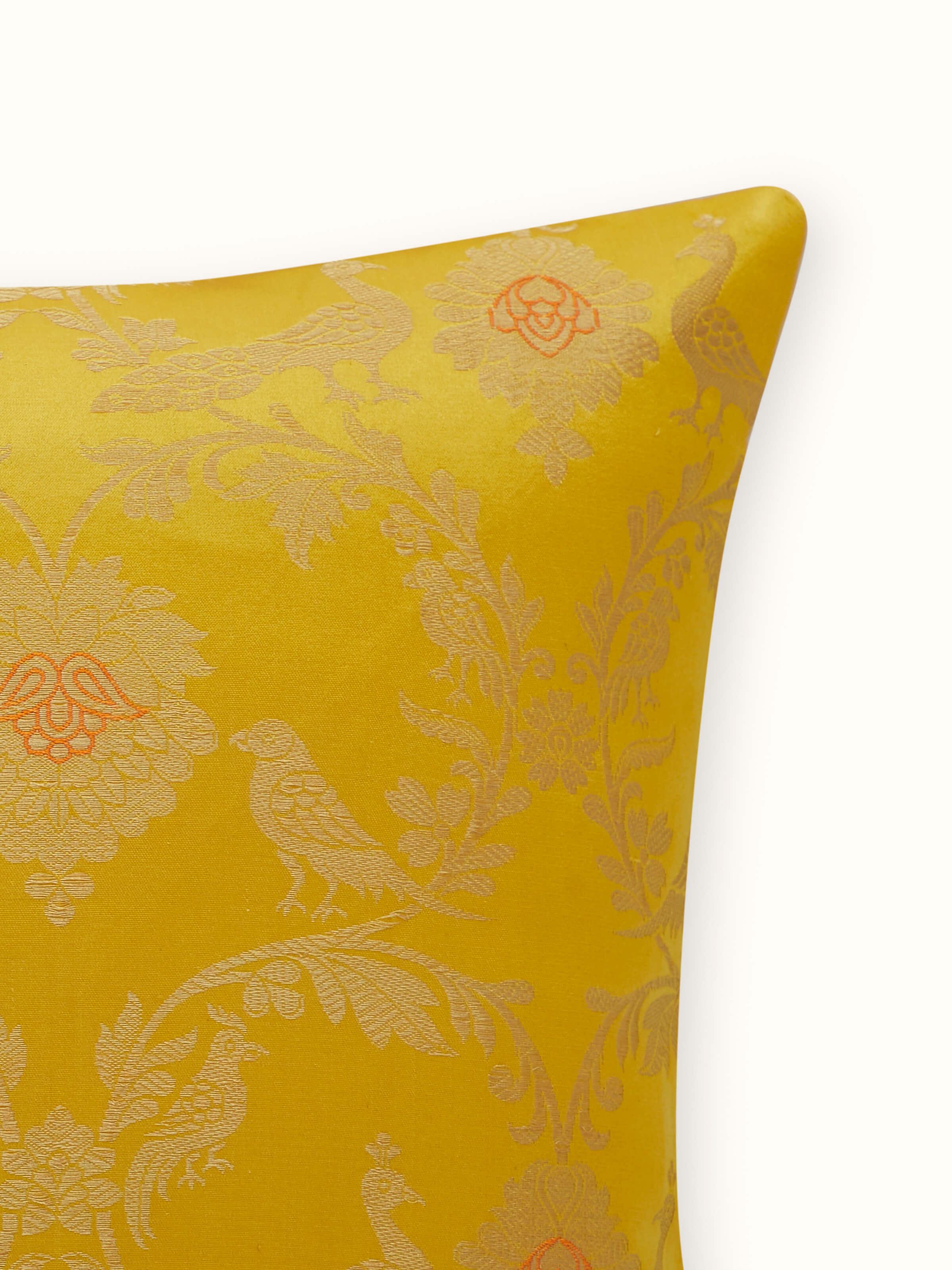 Detail shot of silk weave and elegant border finishing on the cushion cover.