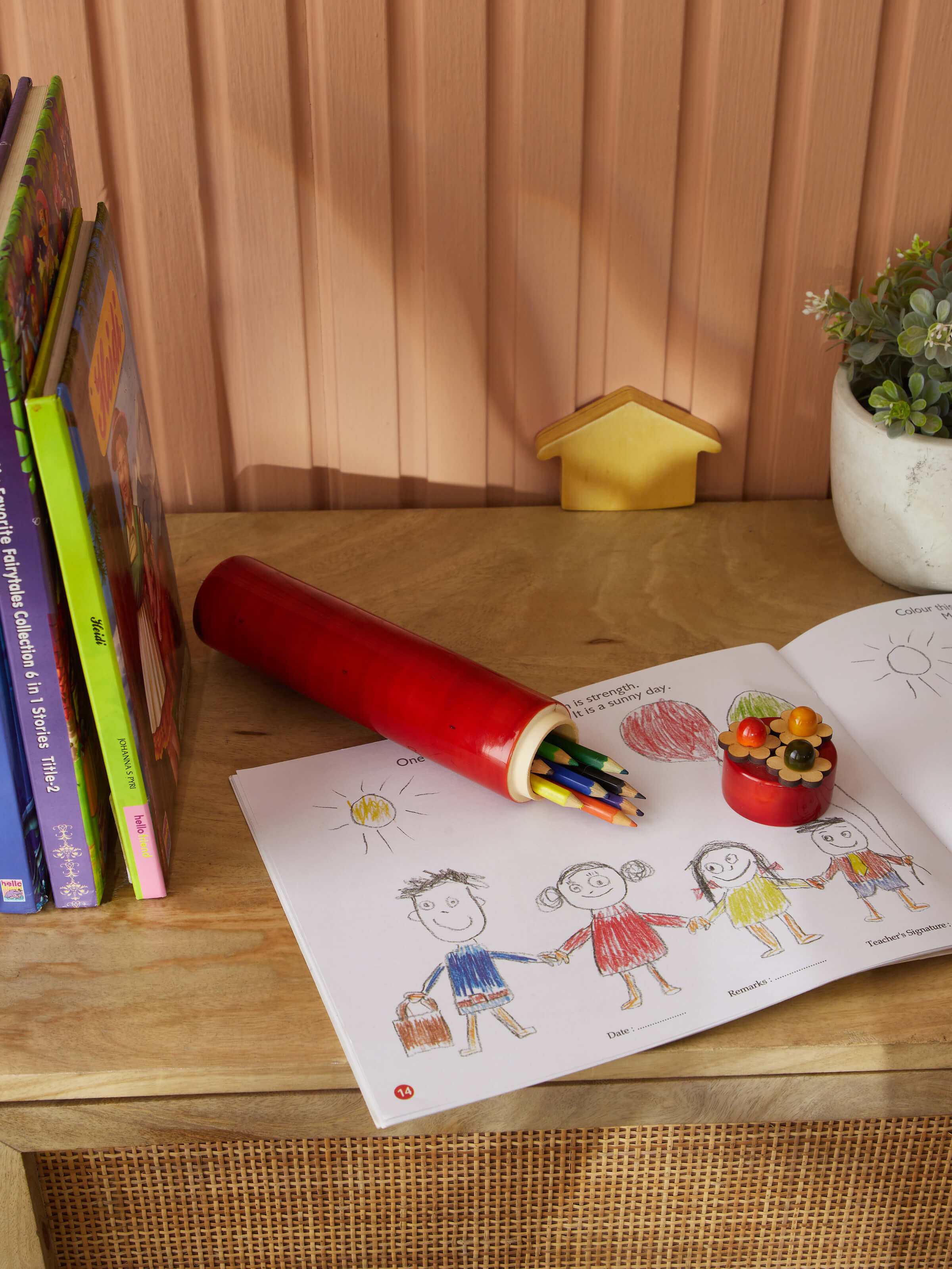 Side view of Channapatna Ivory Wood Sketch Kase Red from Swadesh highlighting its smooth wood finish and fine craftsmanship