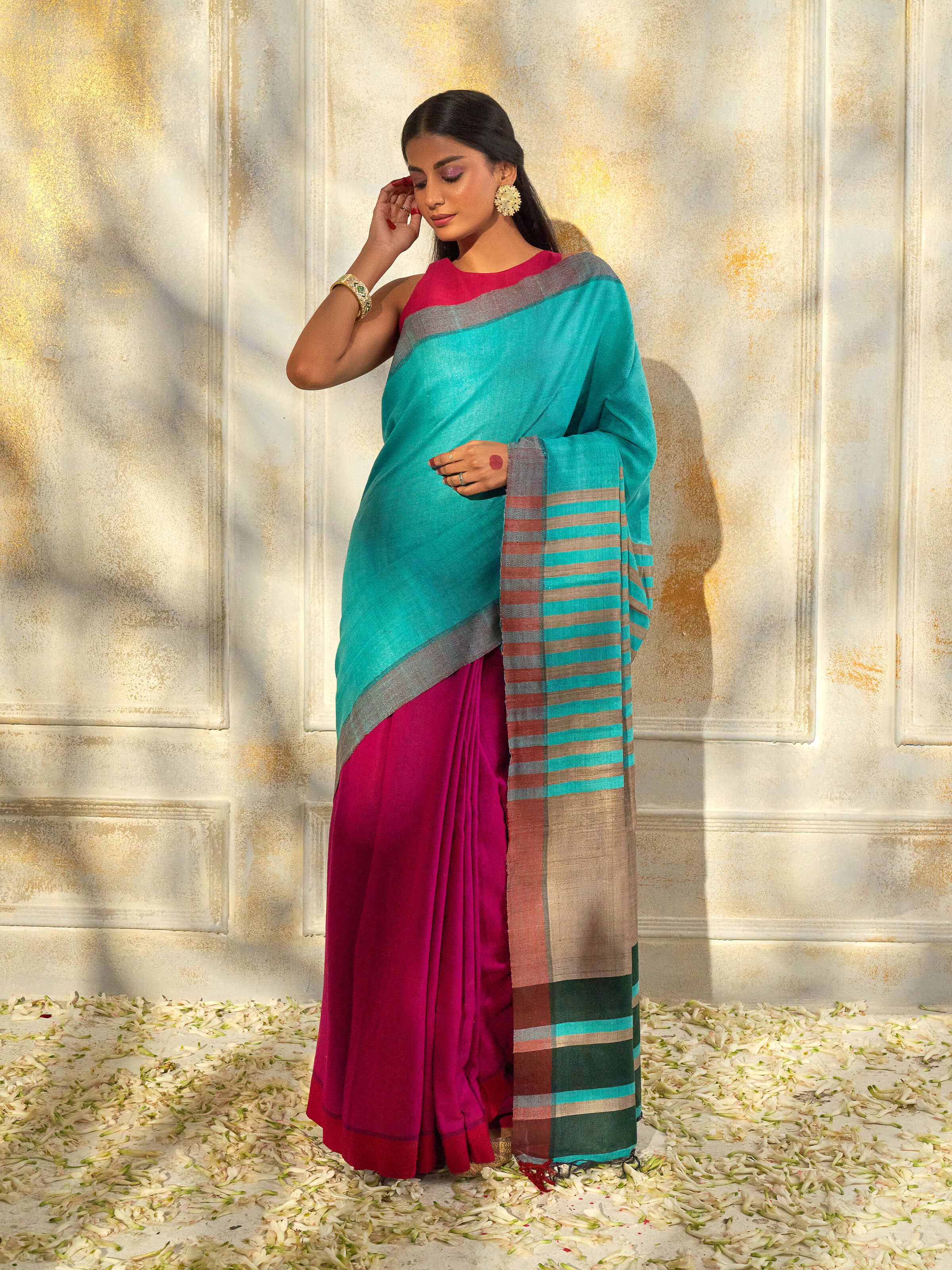 Side view of turquoise tussar silk Bhagalpur saree showcasing fluid drape