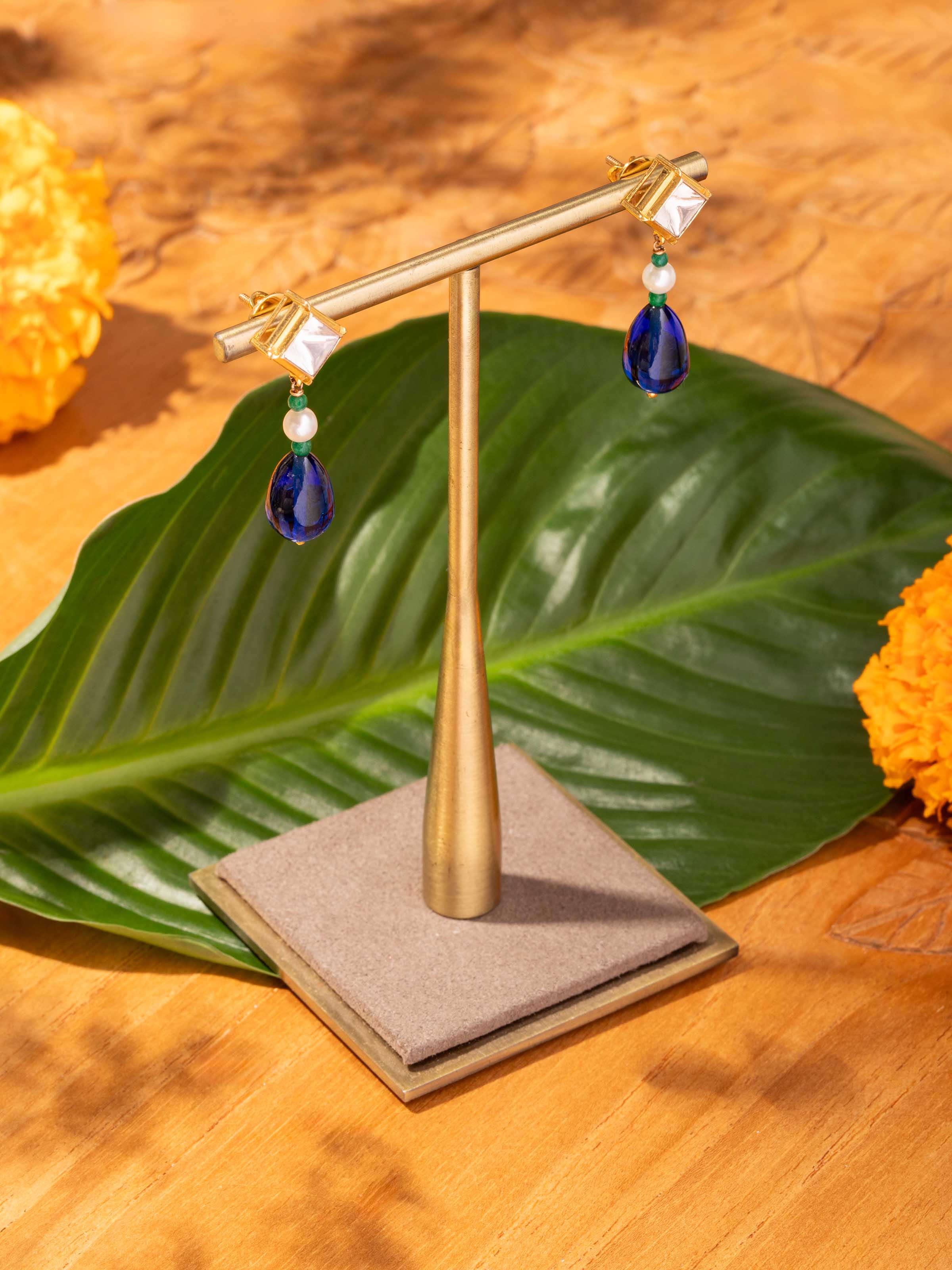 Lifestyle view of Dank Polki earrings styled with festive attire for an opulent look.