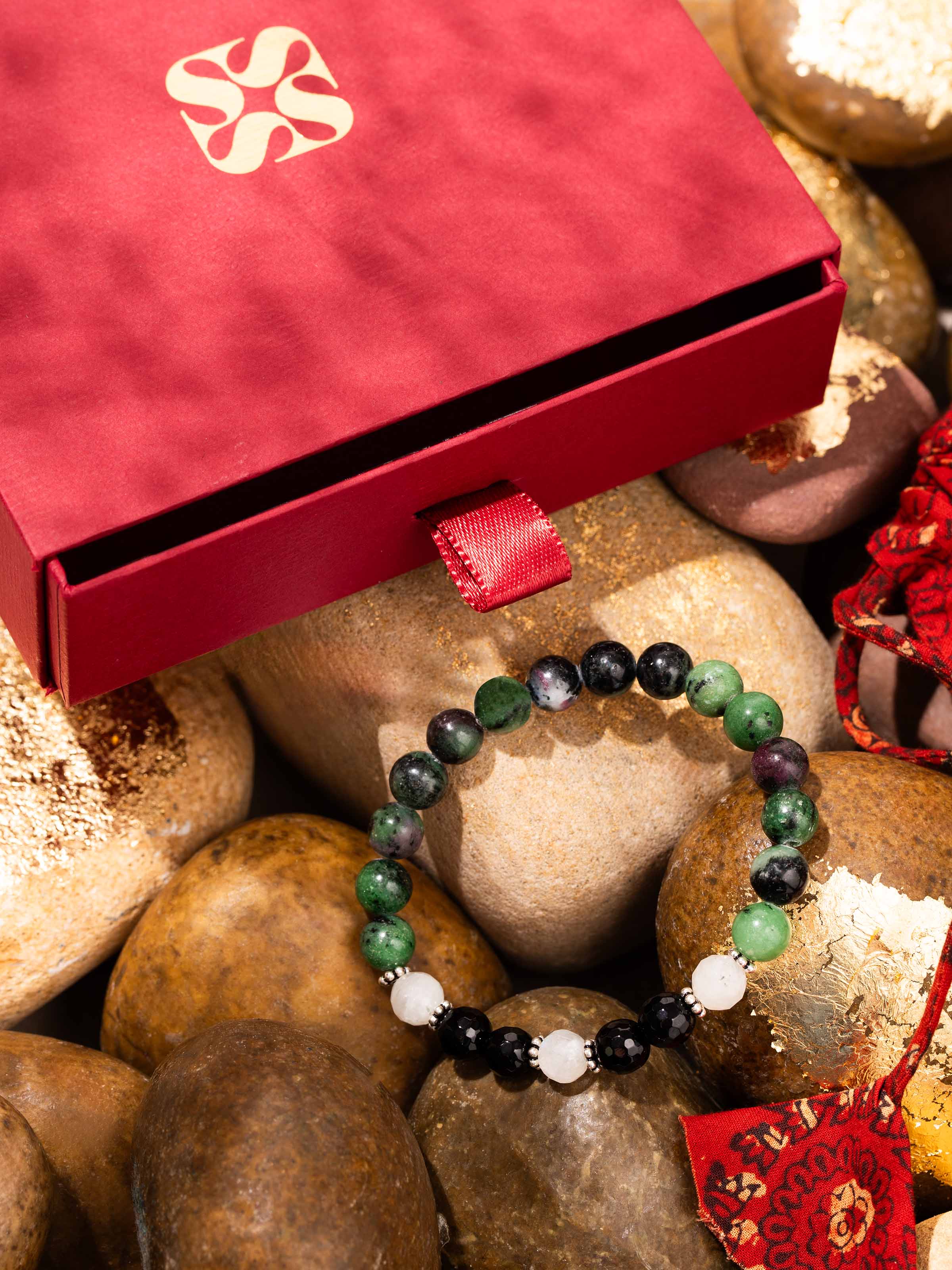 Side view of Malachite, Onyx & Moonstone Bracelet, showcasing the trio of gemstones in a balanced design