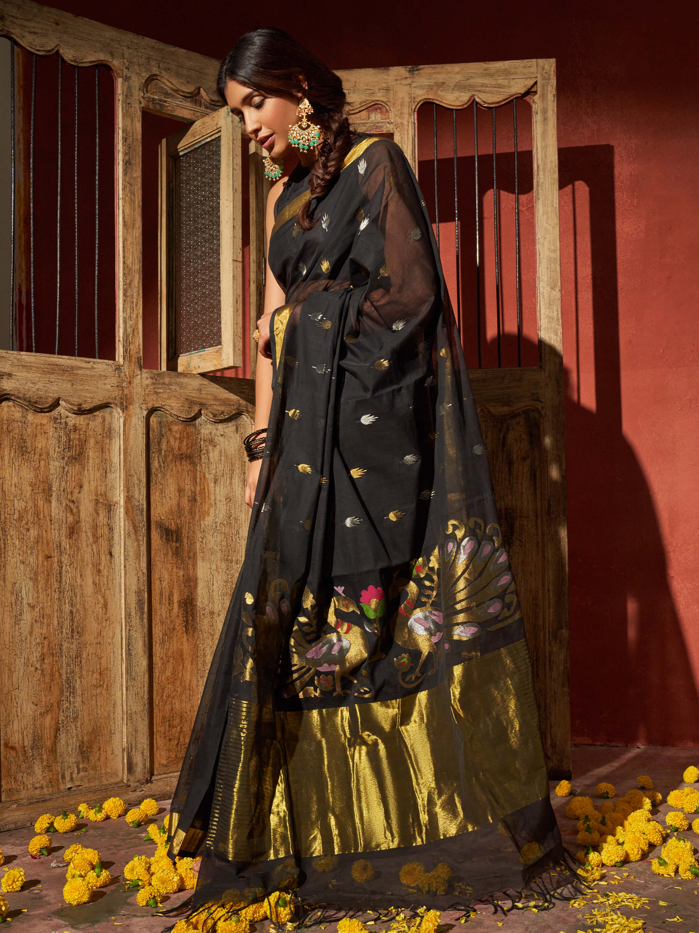 Angled view of black cotton Venkatagiri saree highlighting fine Venkatagiri weave
