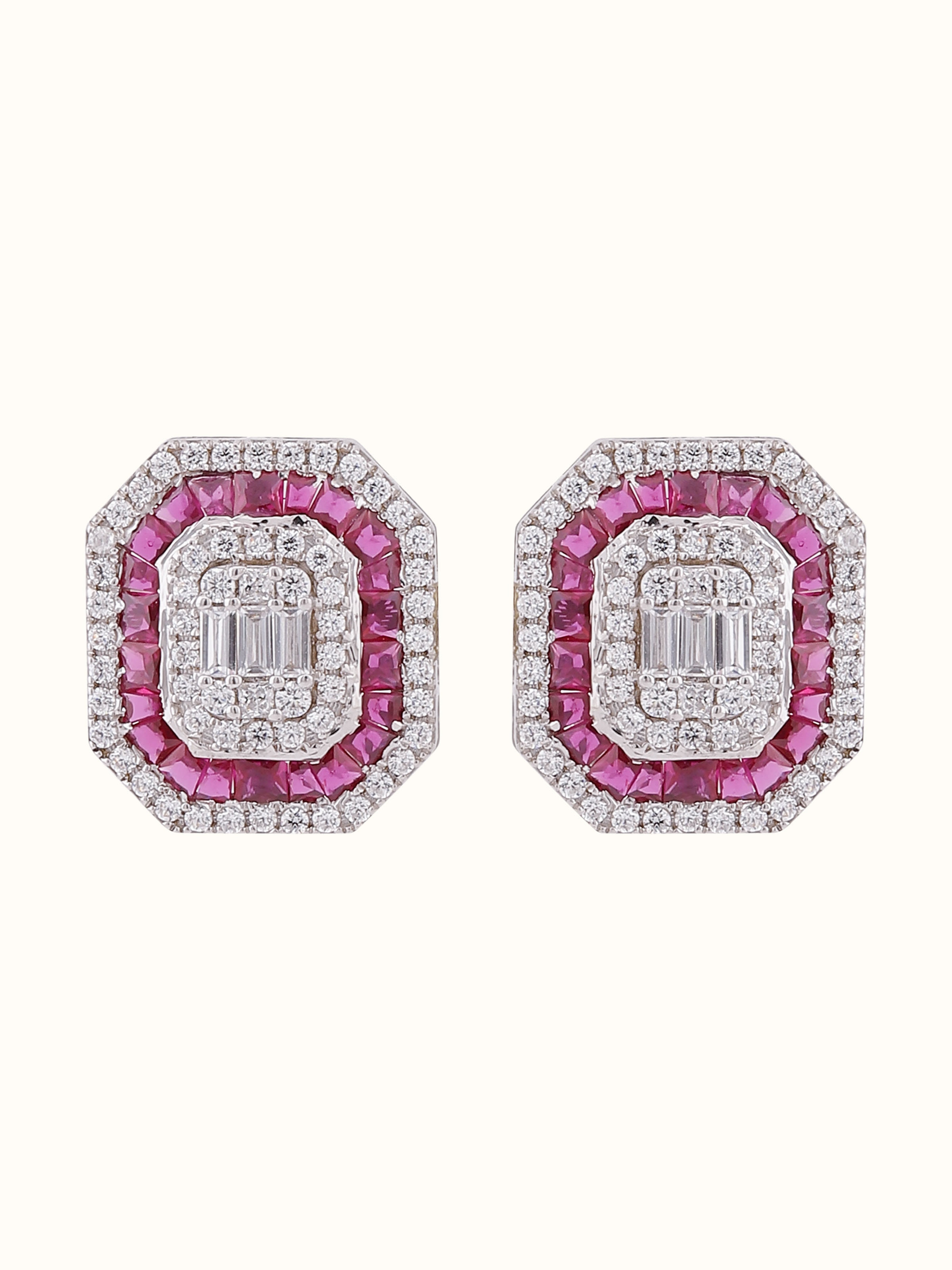 Front view of Silver Smithing stud earrings with floral detailing and oxidized silver finish.