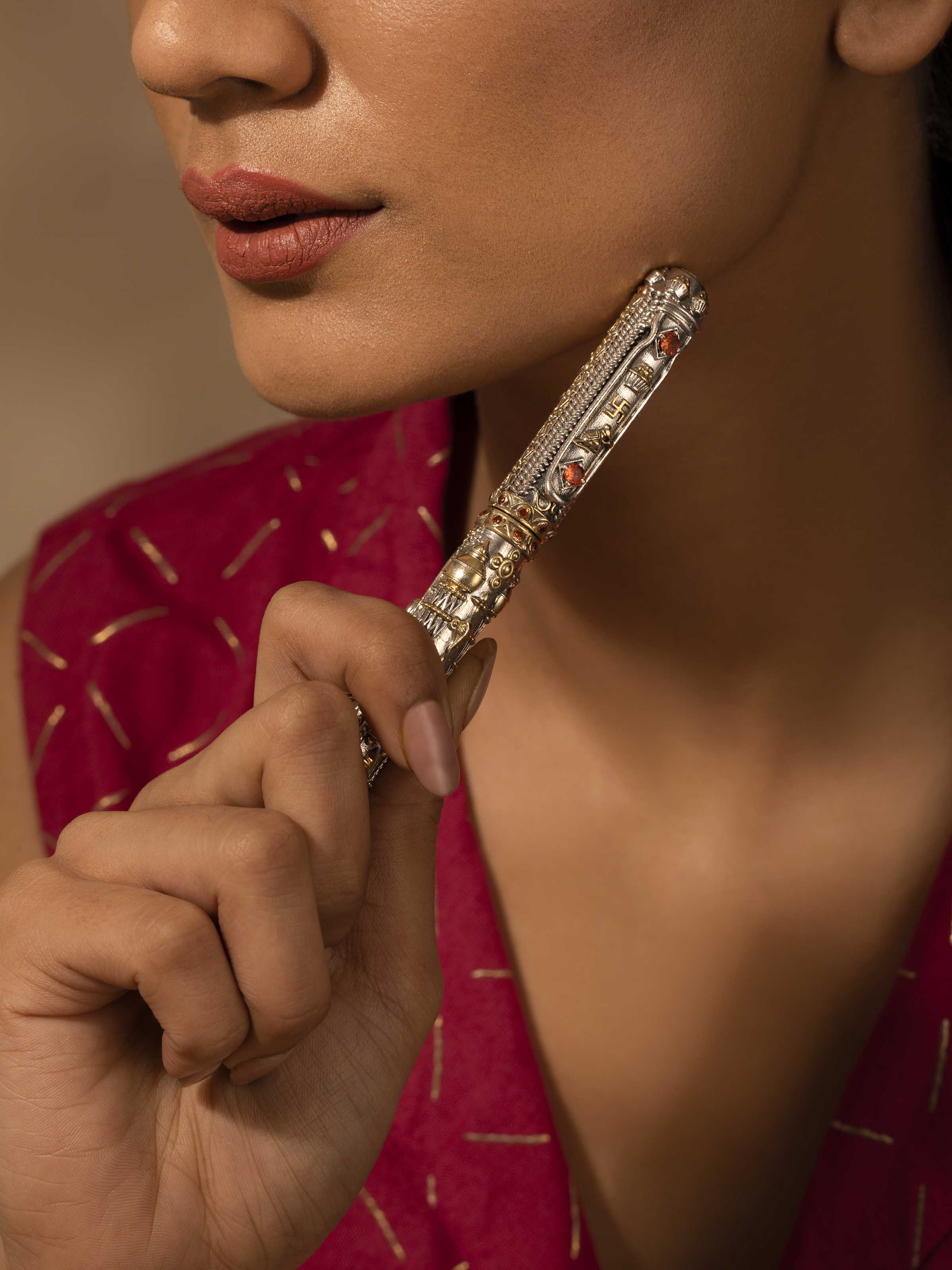 Angled view of Lakshmi & Ganesha Silver Smithing Pen featuring detailed artistry by Swadesh