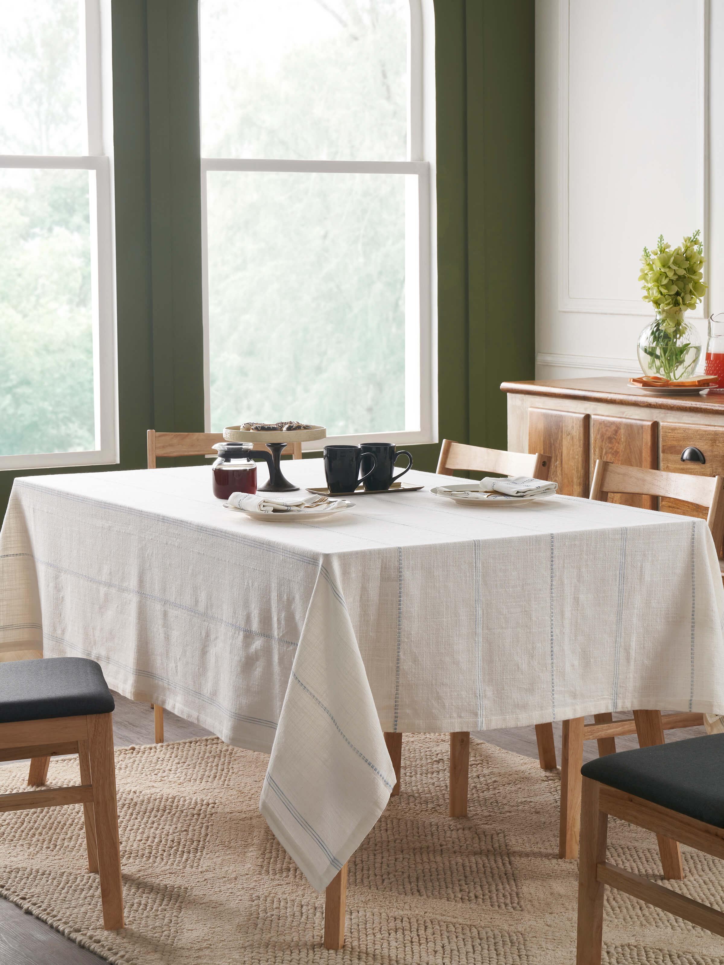 Lifestyle image showing Arth Light Blue Stripe Cotton Handloom Table Cover on 6-seater dining table