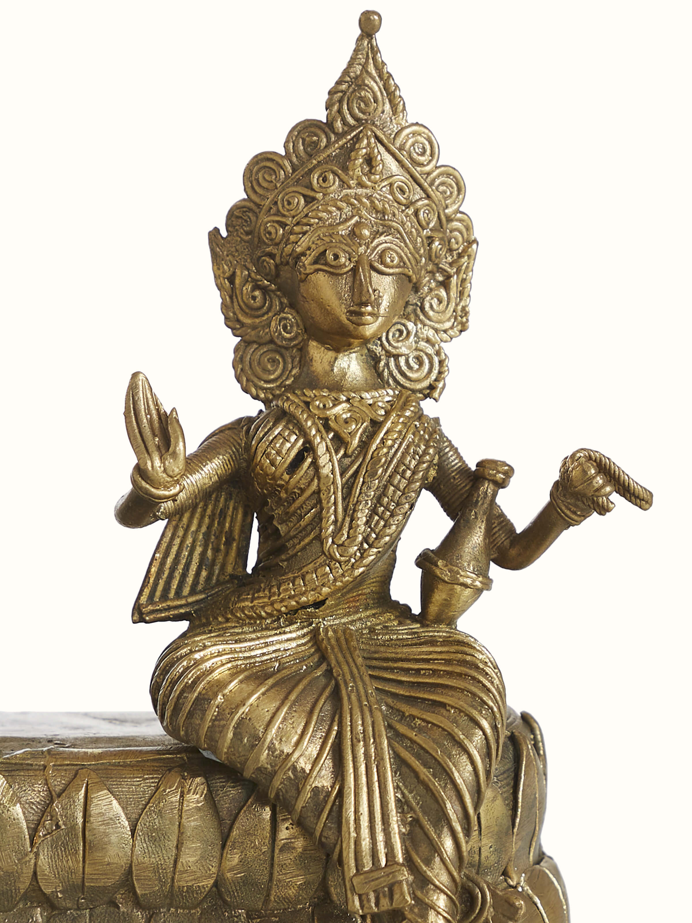 Close-up detail view of Dhokra brass Shiva Parvati sculpture texture