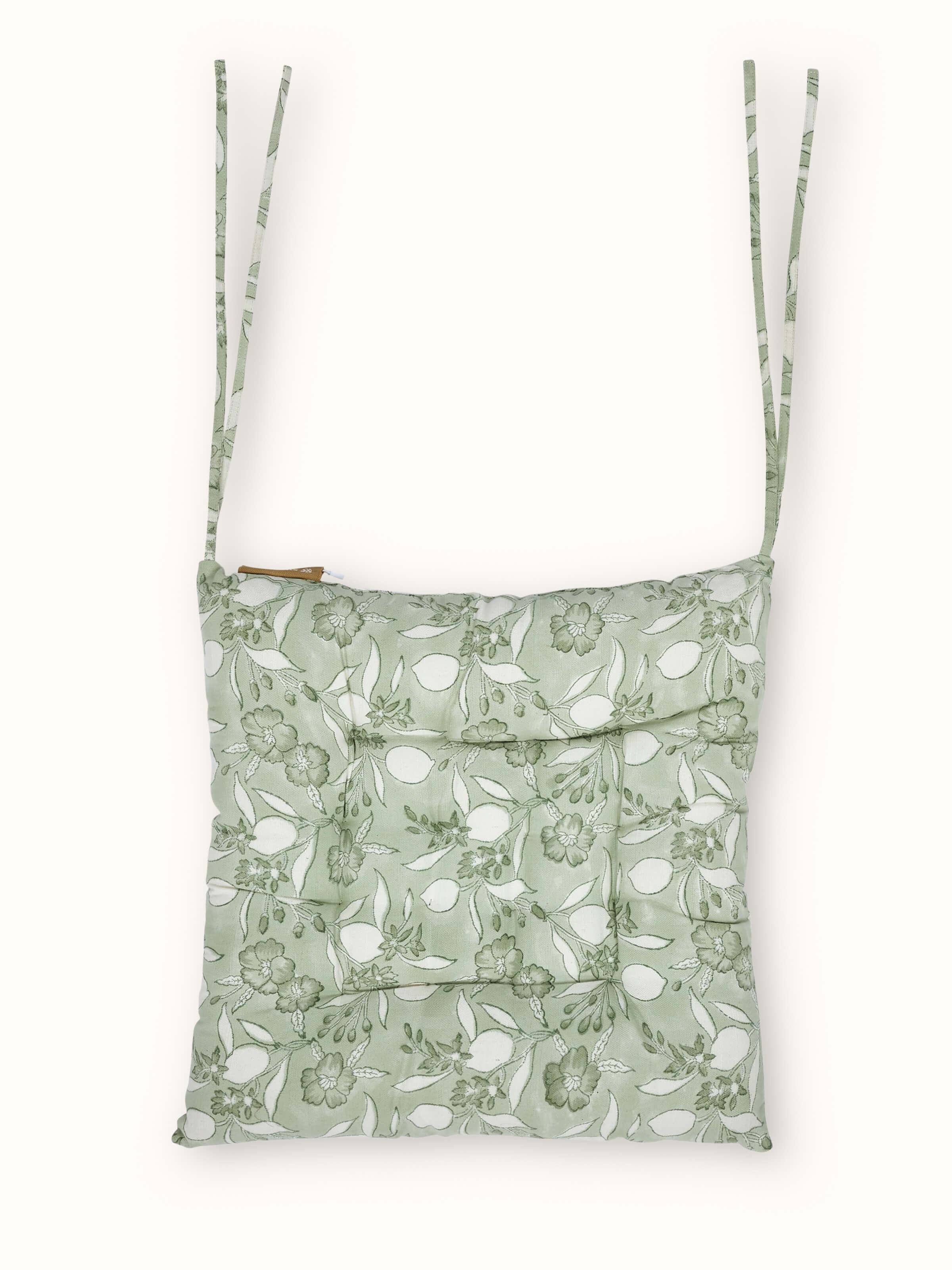 Front view showing the green floral Sanganeri hand block print on cotton fabric
