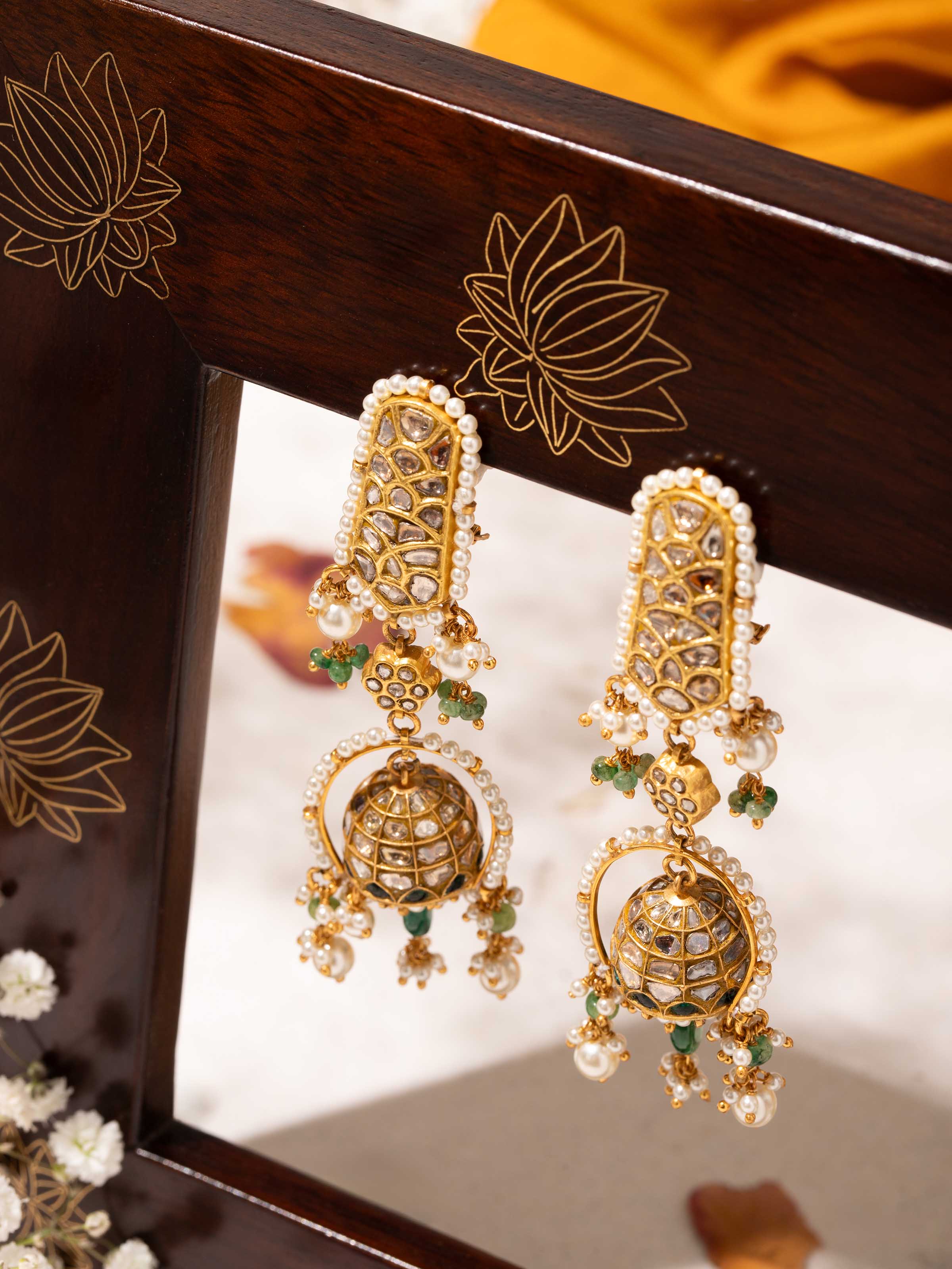 Alternate side view of Thappa 22 karat gold drop earrings displaying ornate details and classic silhouette