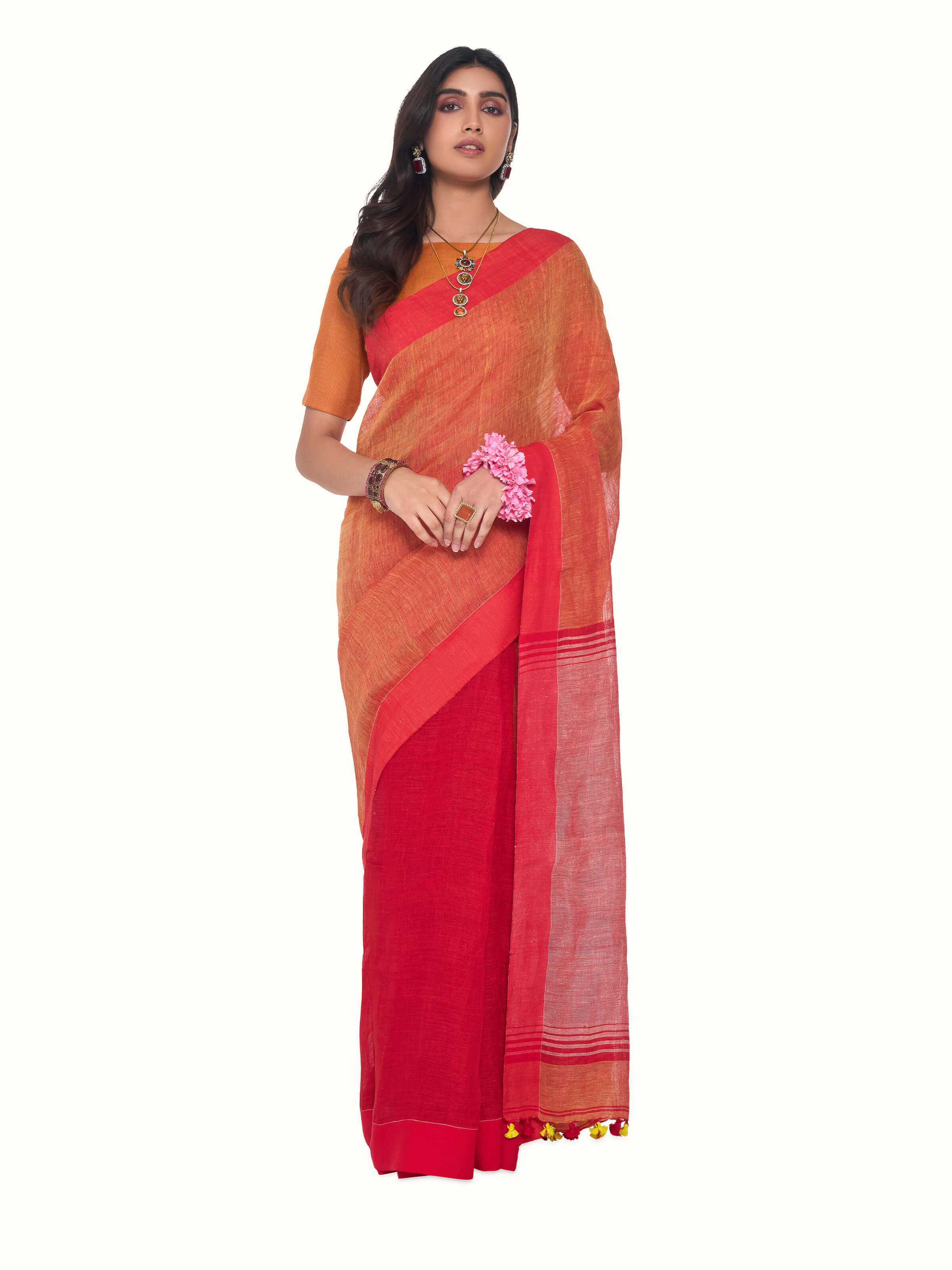 Front view of orange linen saree showcasing fresh tone and lightweight texture