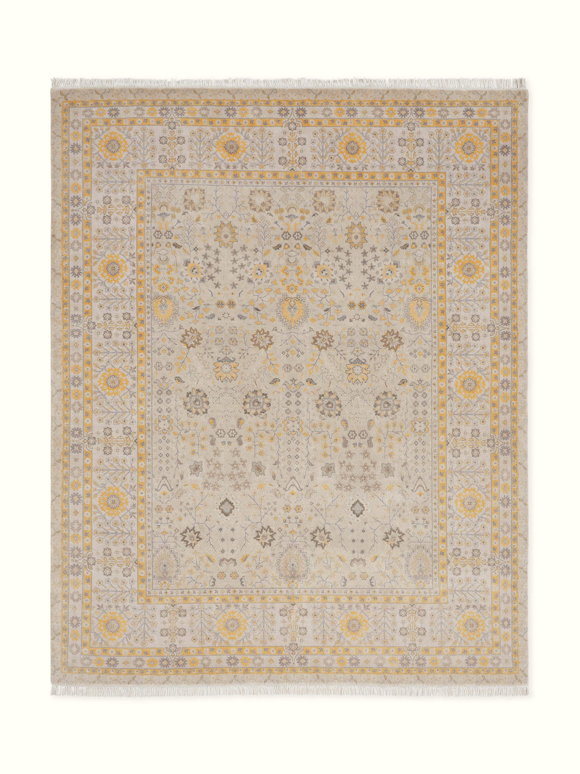 Angled close-up showcasing the intricate hand-knotted wool pattern in grey and gold tones