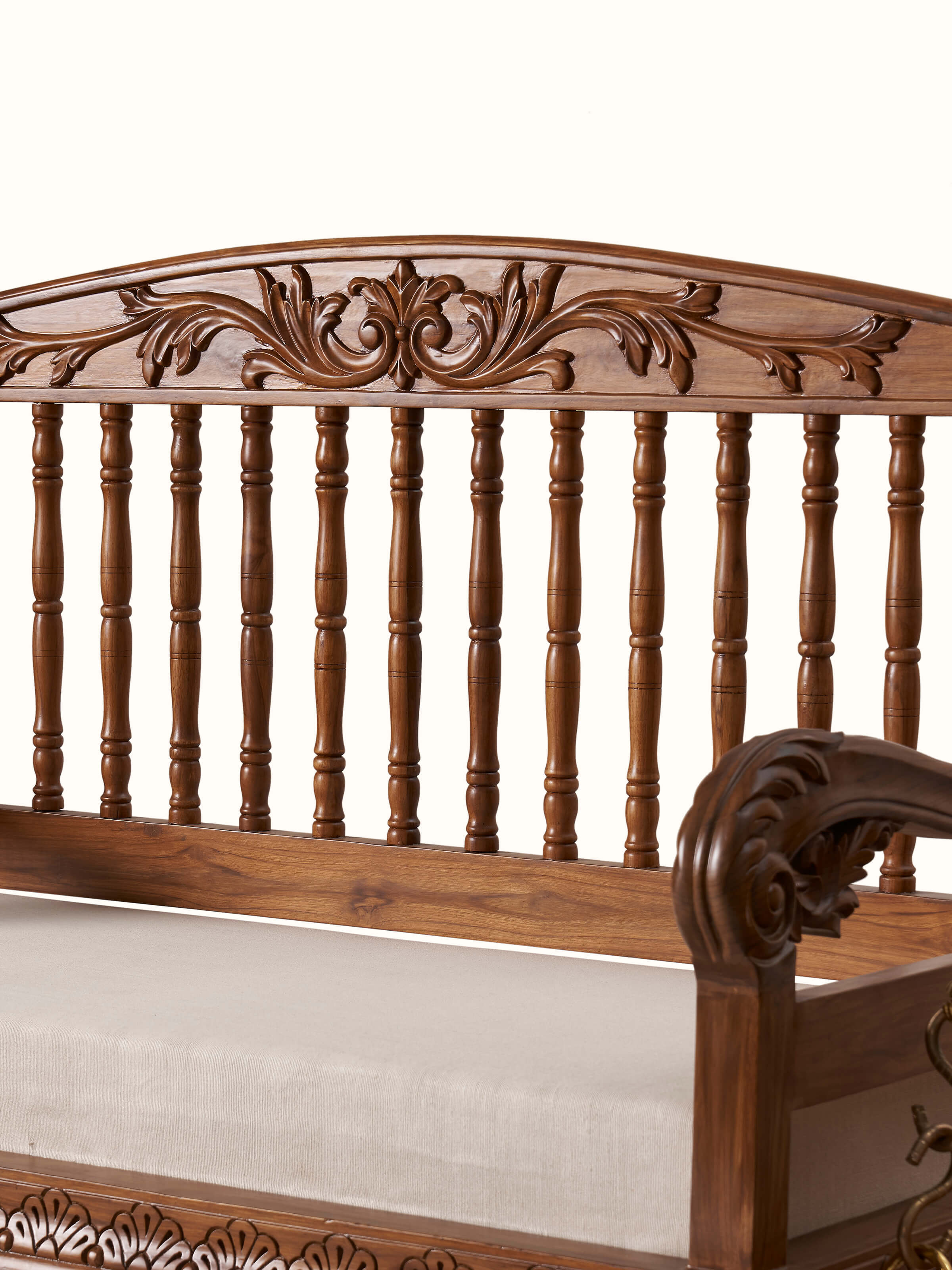 Angled view of the upholstered Sheesham wood 2-seater swing, emphasizing its swing mechanism and rich upholstery