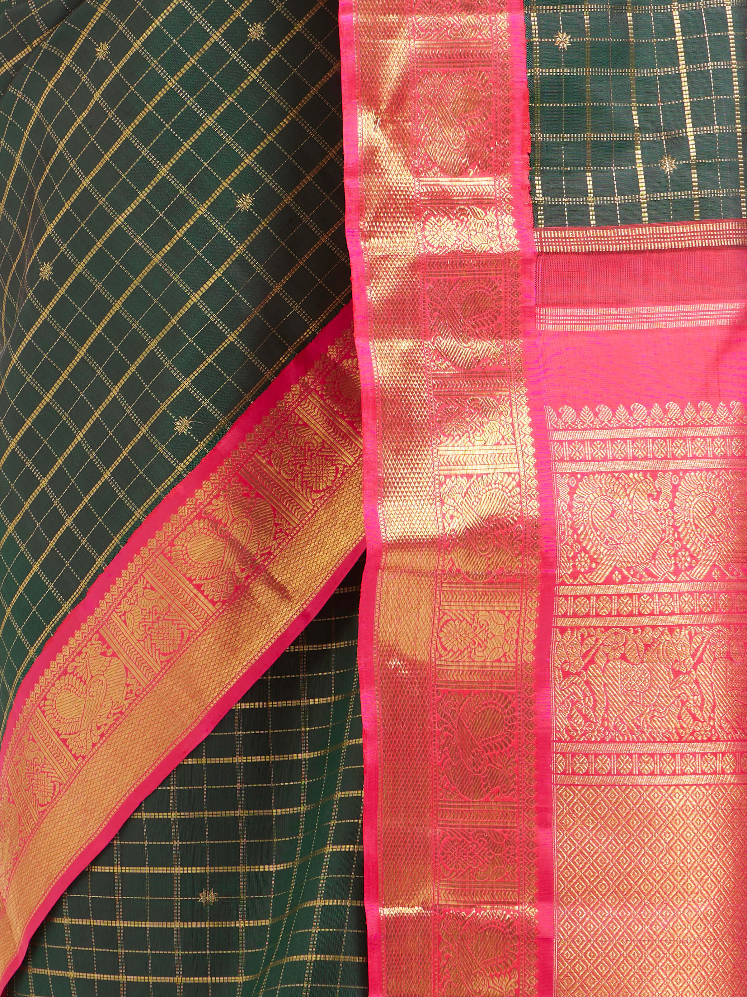 Detail view of green silk Kancheepuram saree showing fine silk texture and intricate zari craftsmanship