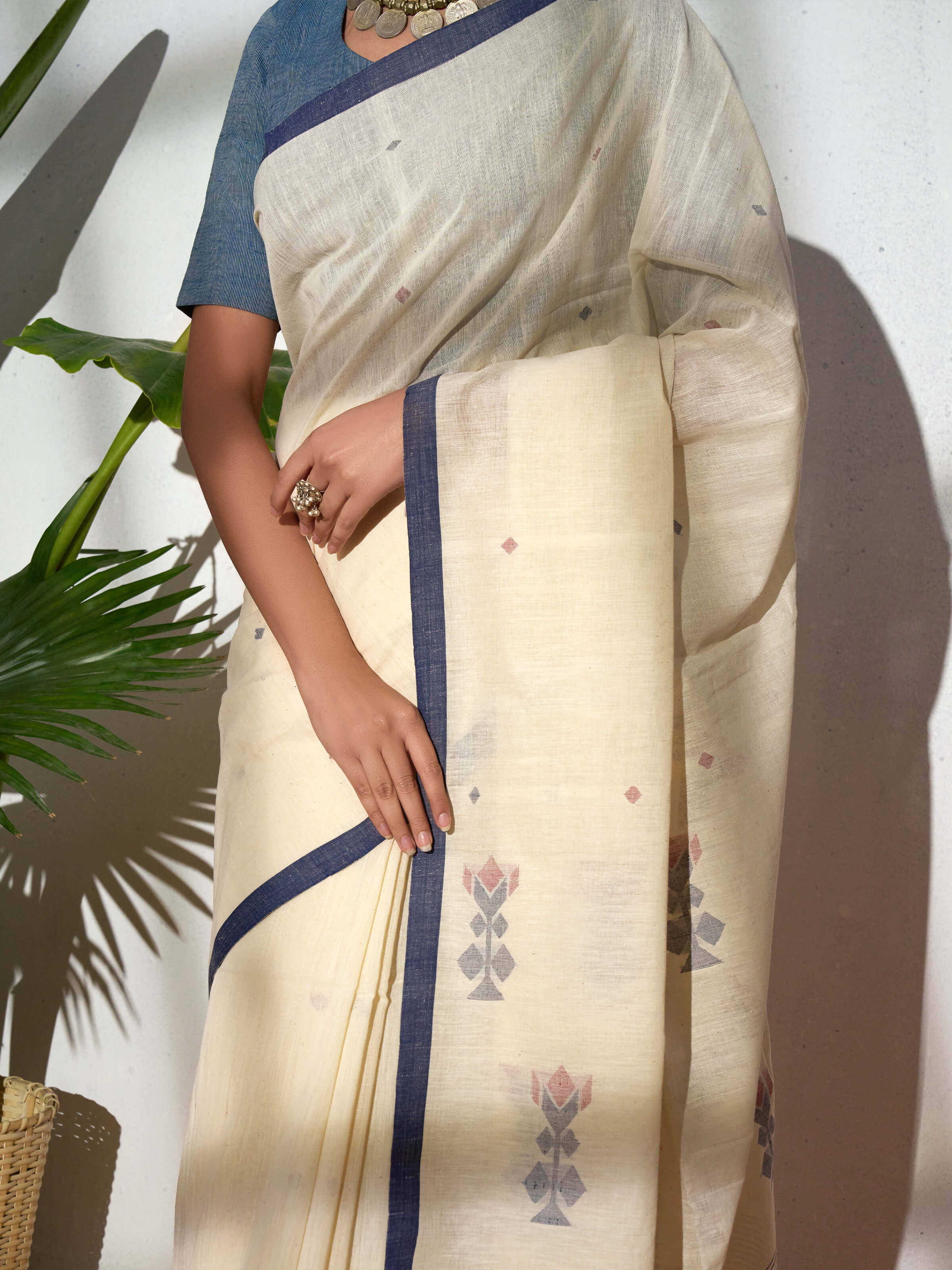 Detail view of blue cotton Bengal saree showcasing fabric texture