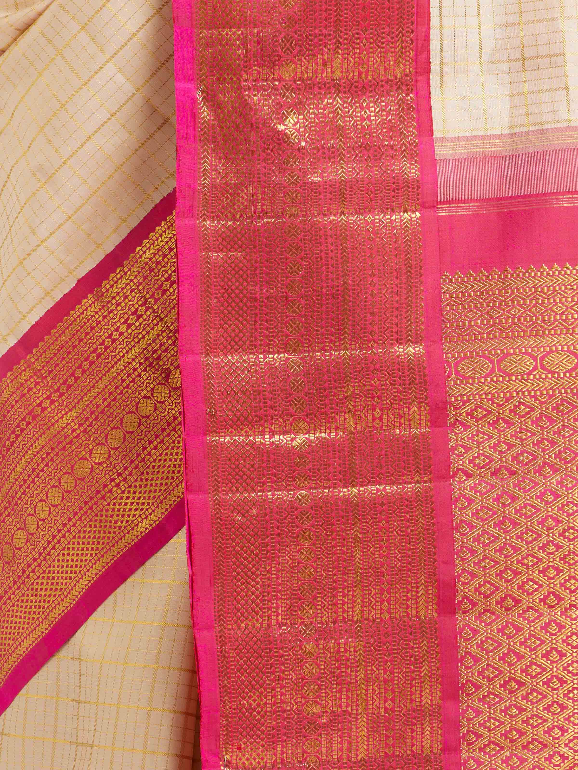 Detail view of cream silk Kancheepuram saree showing silk texture and zari craftsmanship