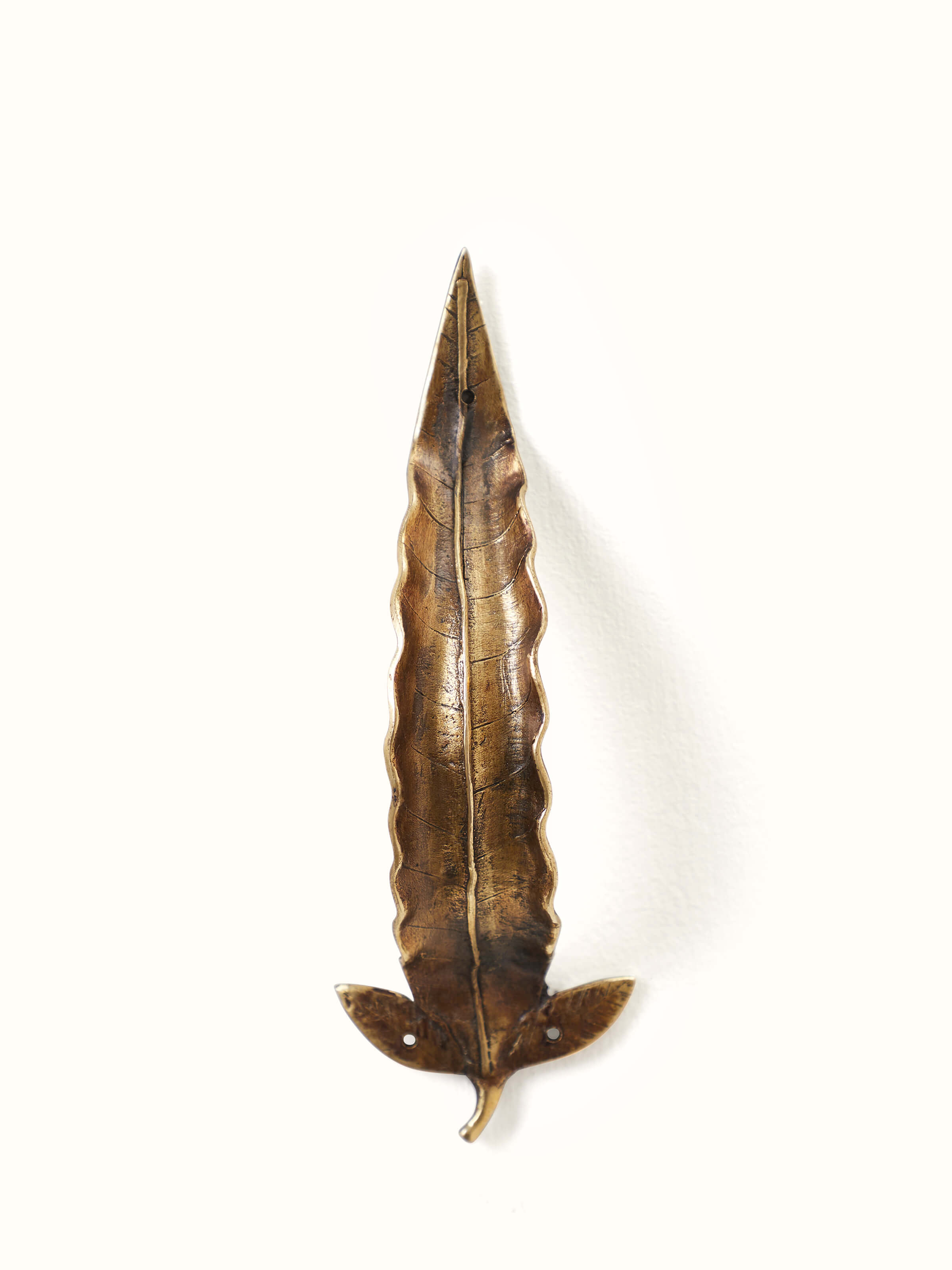 Front view of Swadesh Dhokra Brass Leaves Door Handle featuring unique brass craftsmanship and leaf motifs.