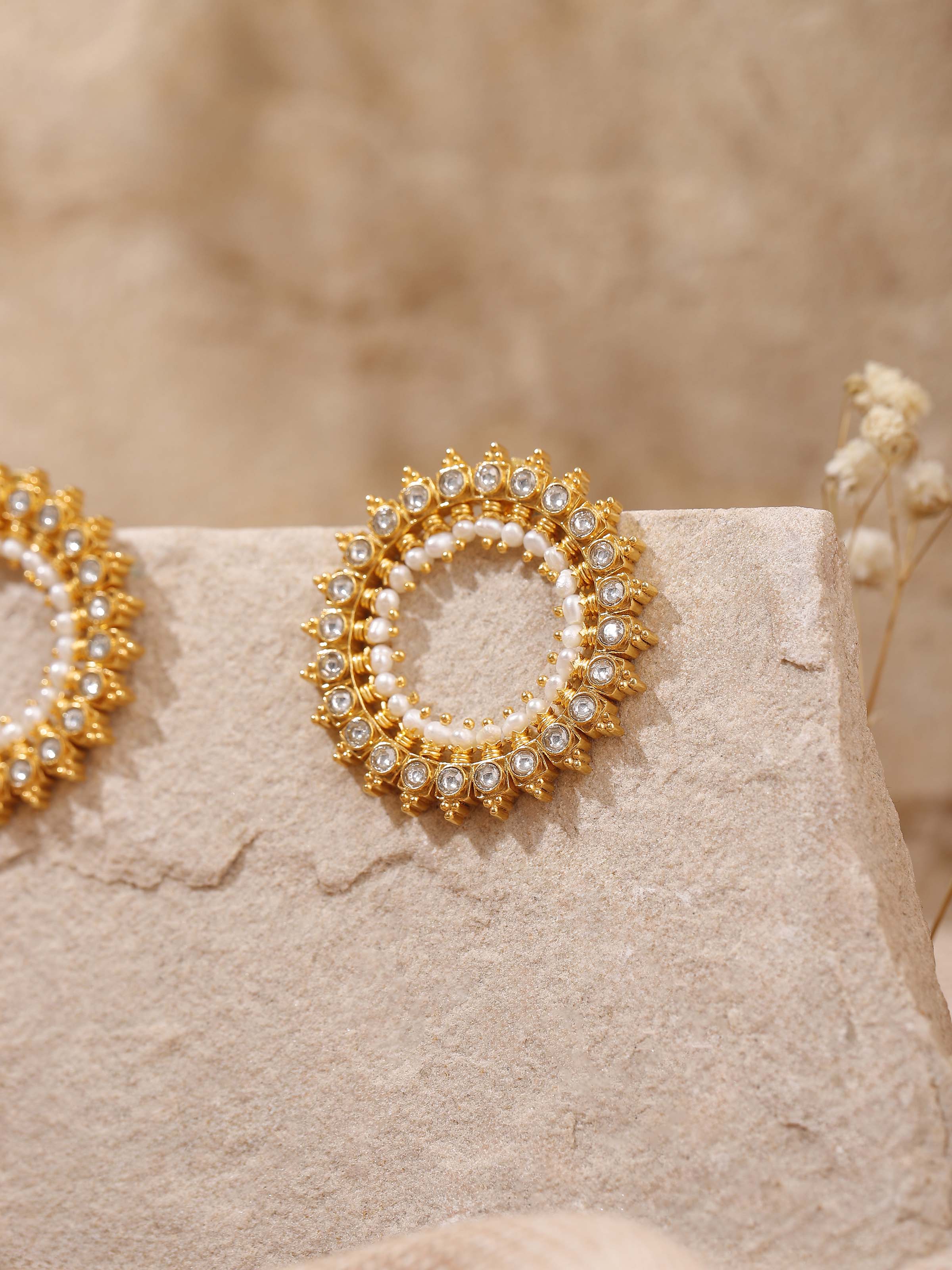 Alternate lifestyle shot of Guttapusalu silver studs highlighting elegant side profile.