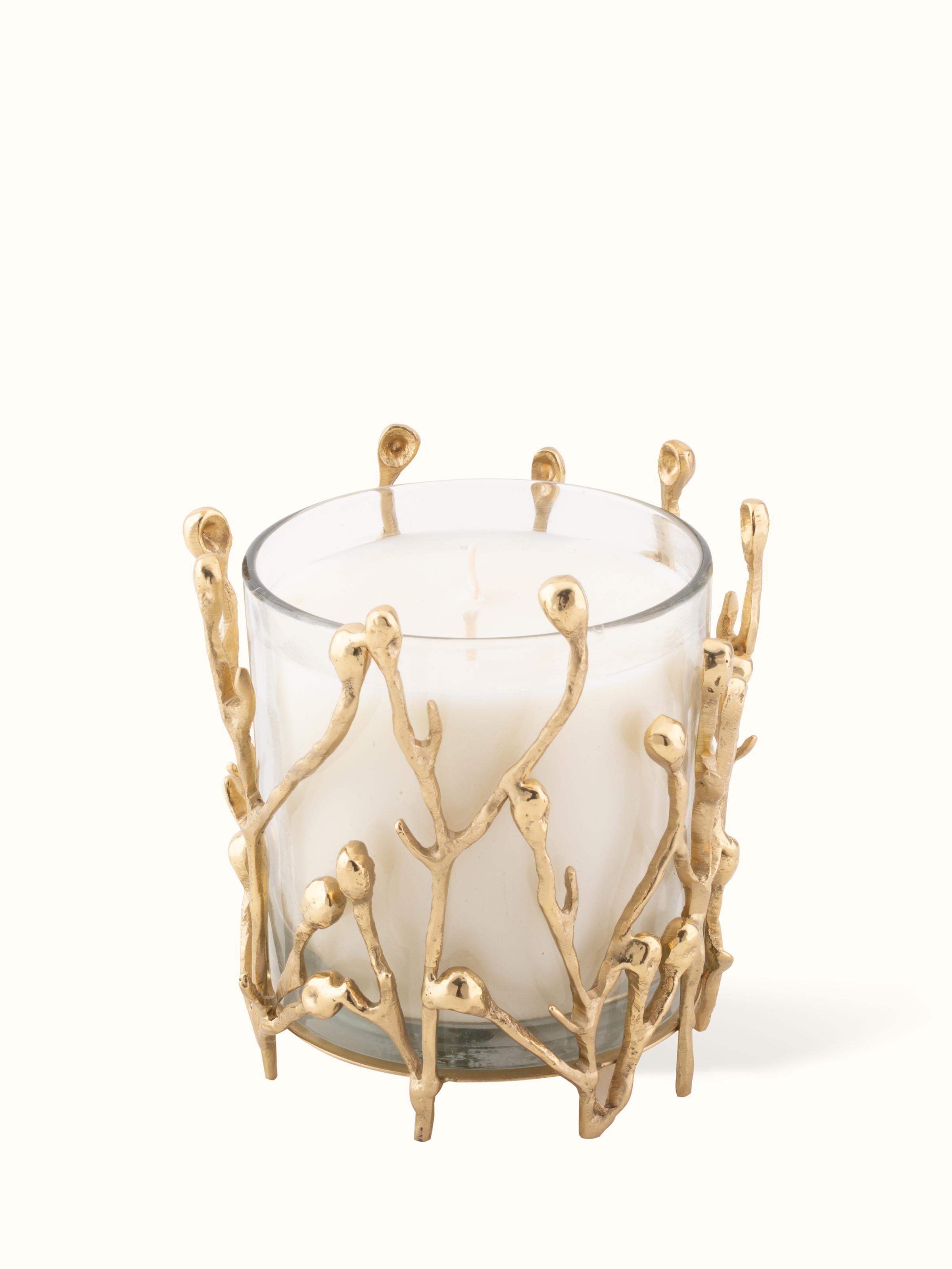Front view of medium brass candle showcasing its elegant design and warm glow