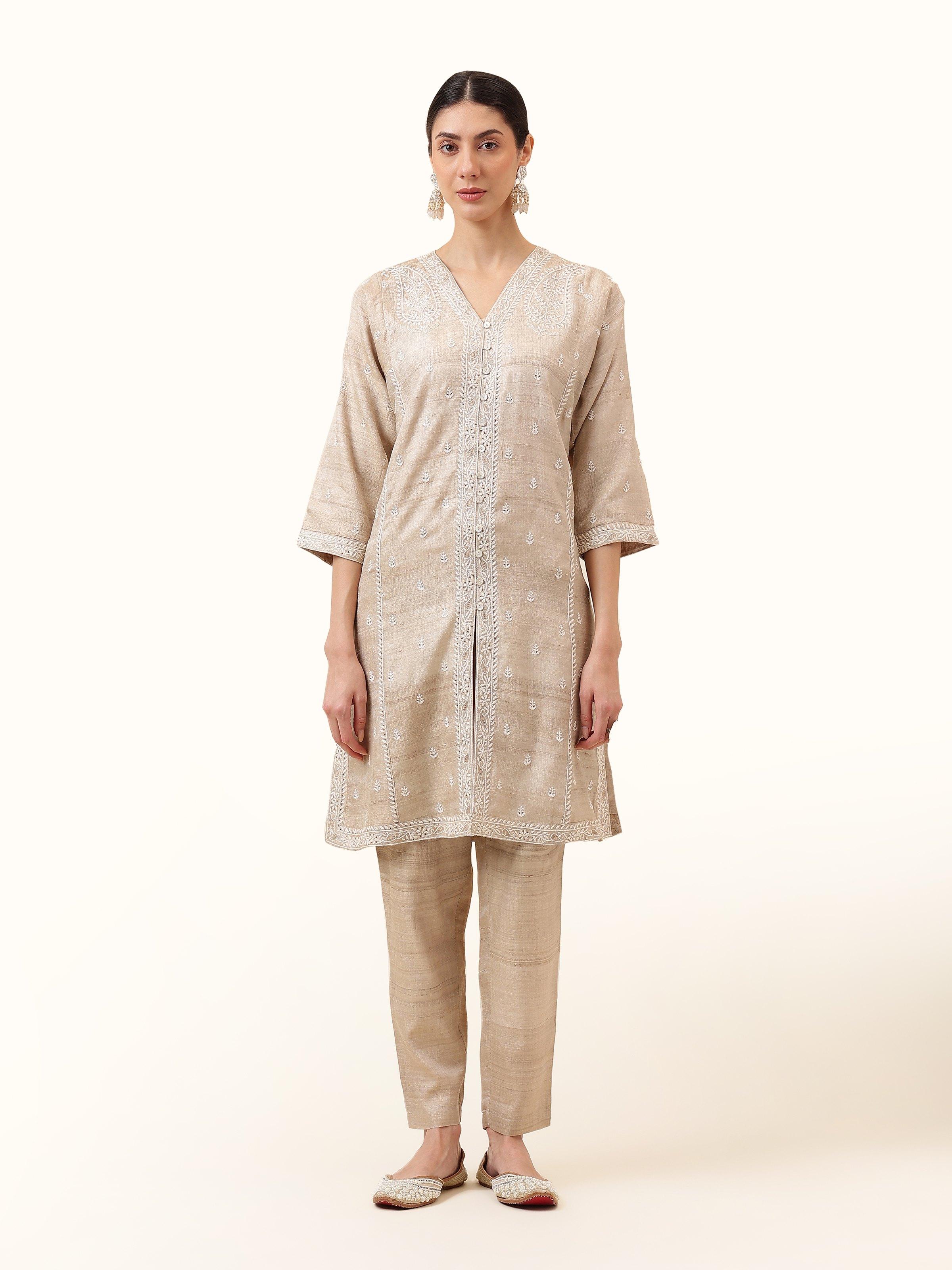 Front view highlighting the soft beige Tussar silk and delicate Chikankari embroidery that give this jacket its regal charm.