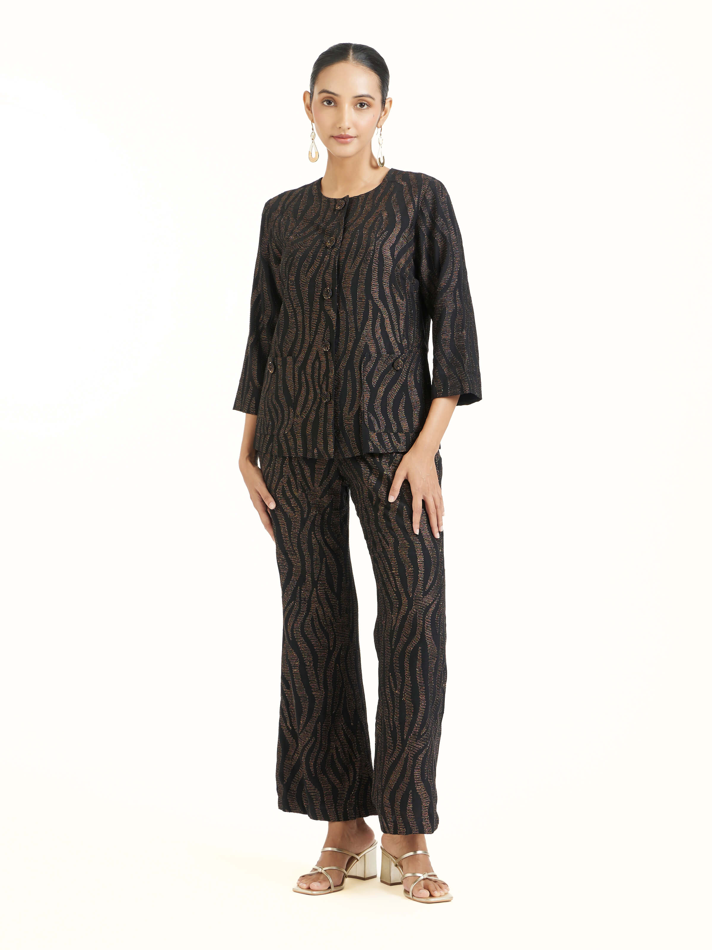 Front view of black Aari hand embroidered pants with intricate motifs