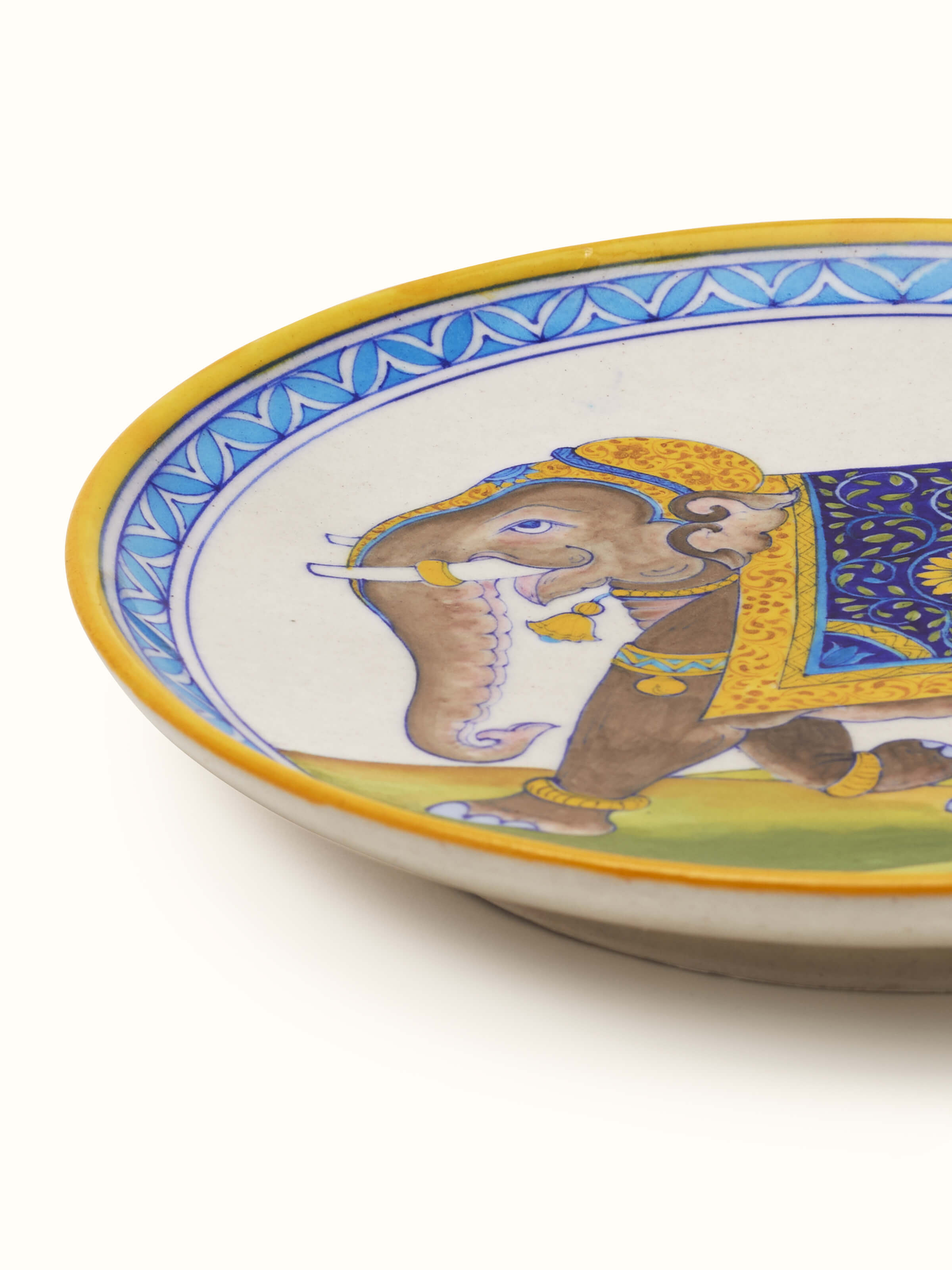 Close-up view of Blue pottery Rajasthani warrior elephant display plate emphasizing the fine details and vibrant colors