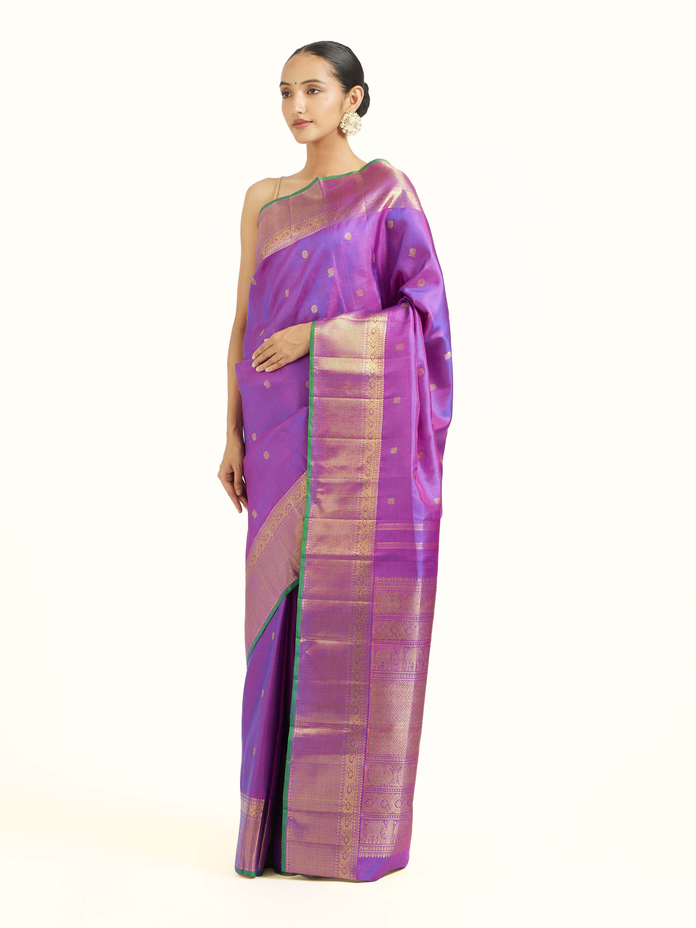 Side view of purple silk Kancheepuram saree showcasing silk sheen