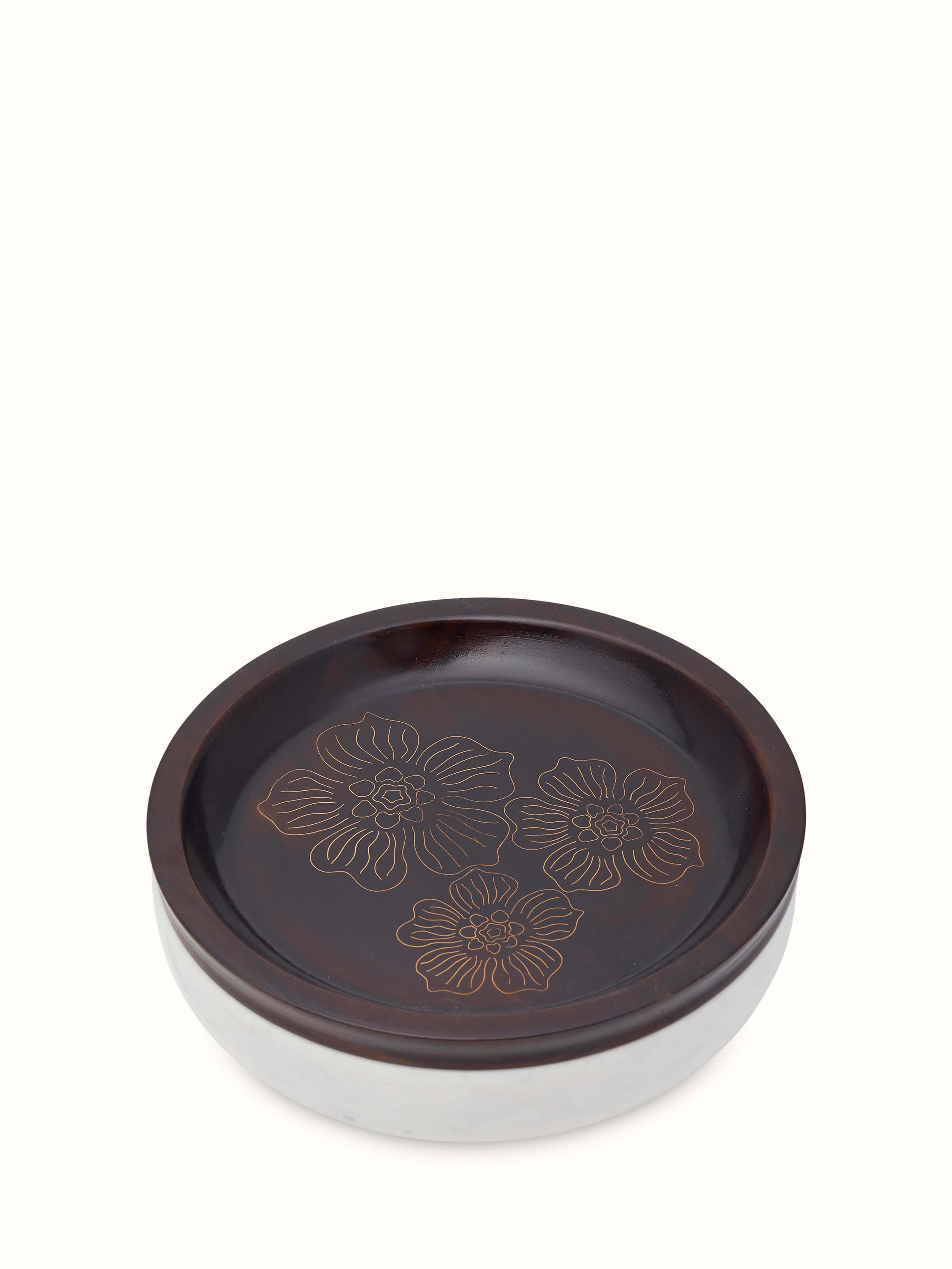 Close-up view of Tarkashi sheesham wood, marble & brass decorative container, focusing on the texture.