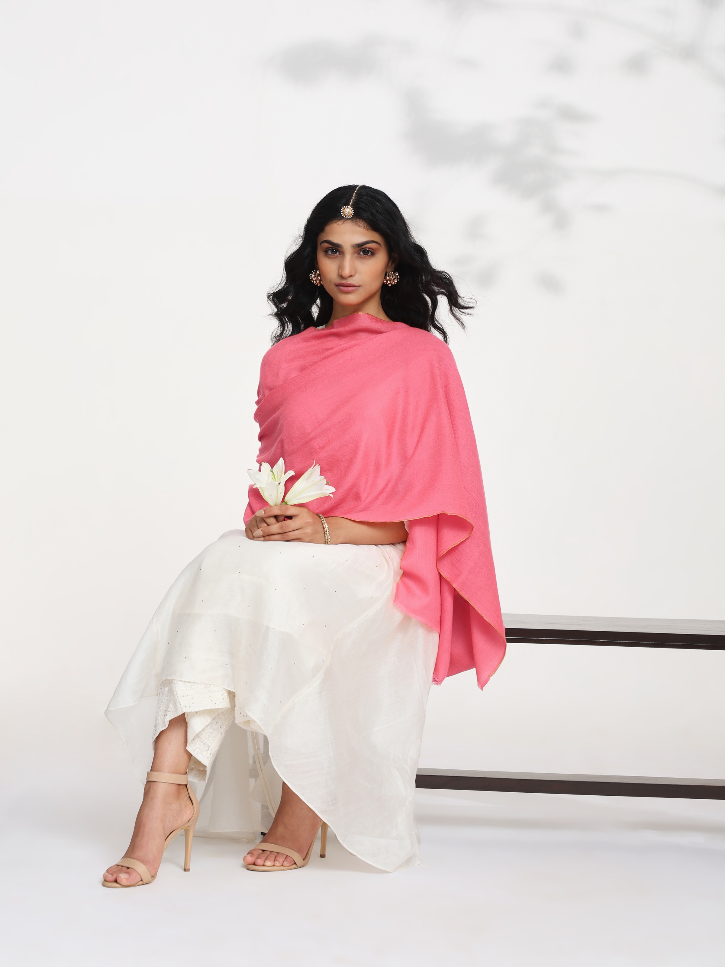 Side view of coral cashmere kaaj embroidered handwoven stole showing soft drape and finish